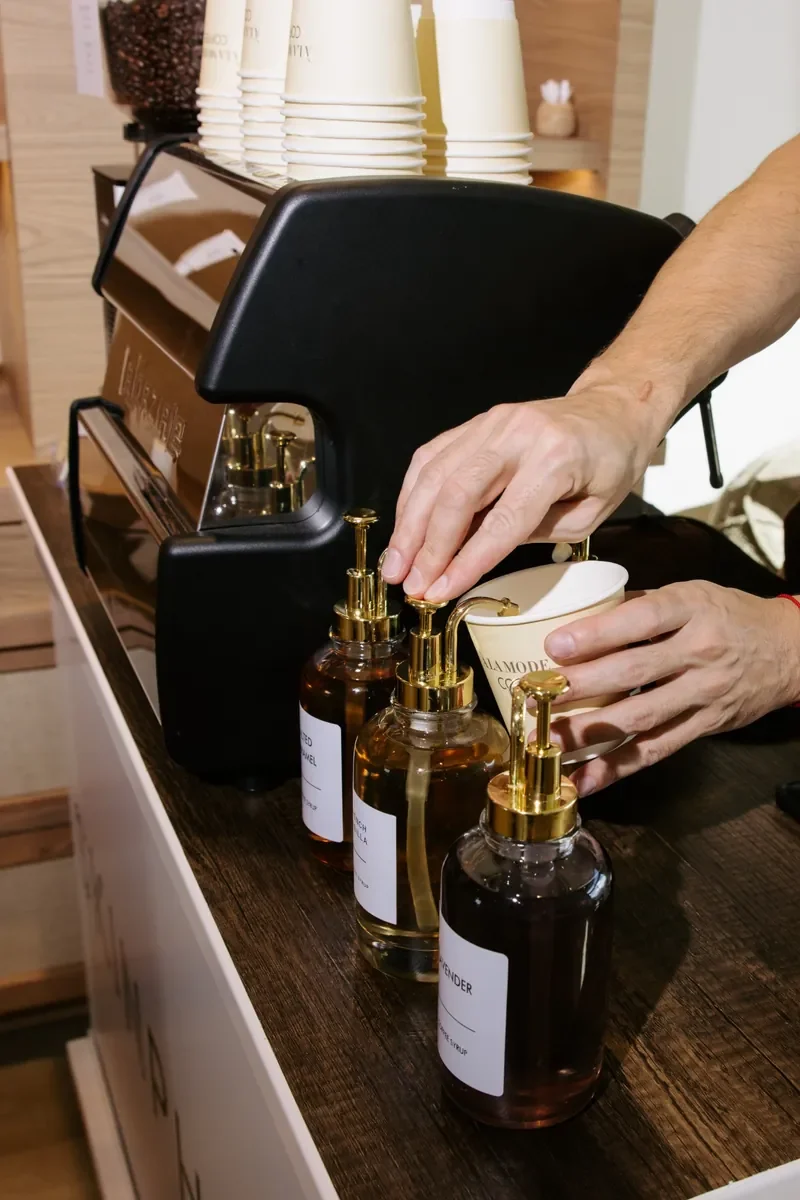 A behind-the-scenes look at drink preparation by À LA MODE COFFEE during  Winter Park grand opening.