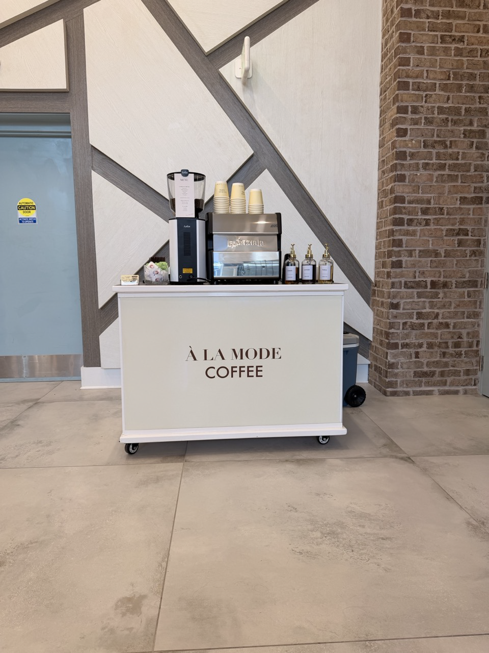 Mobile coffee cart providing espresso catering for residents at a residential community event