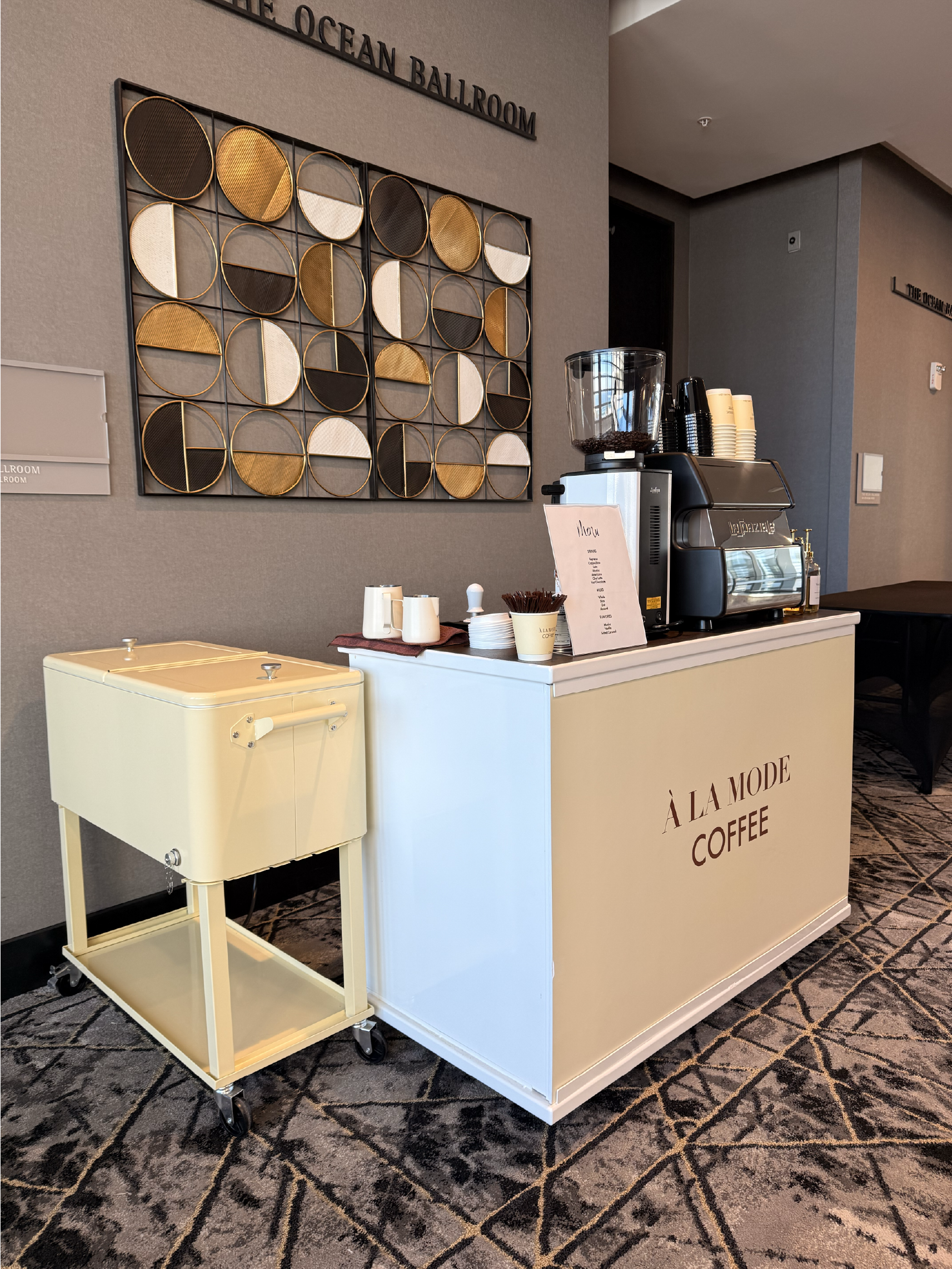 Barista for hire preparing drinks at a mobile espresso bar in Tampa and Orlando