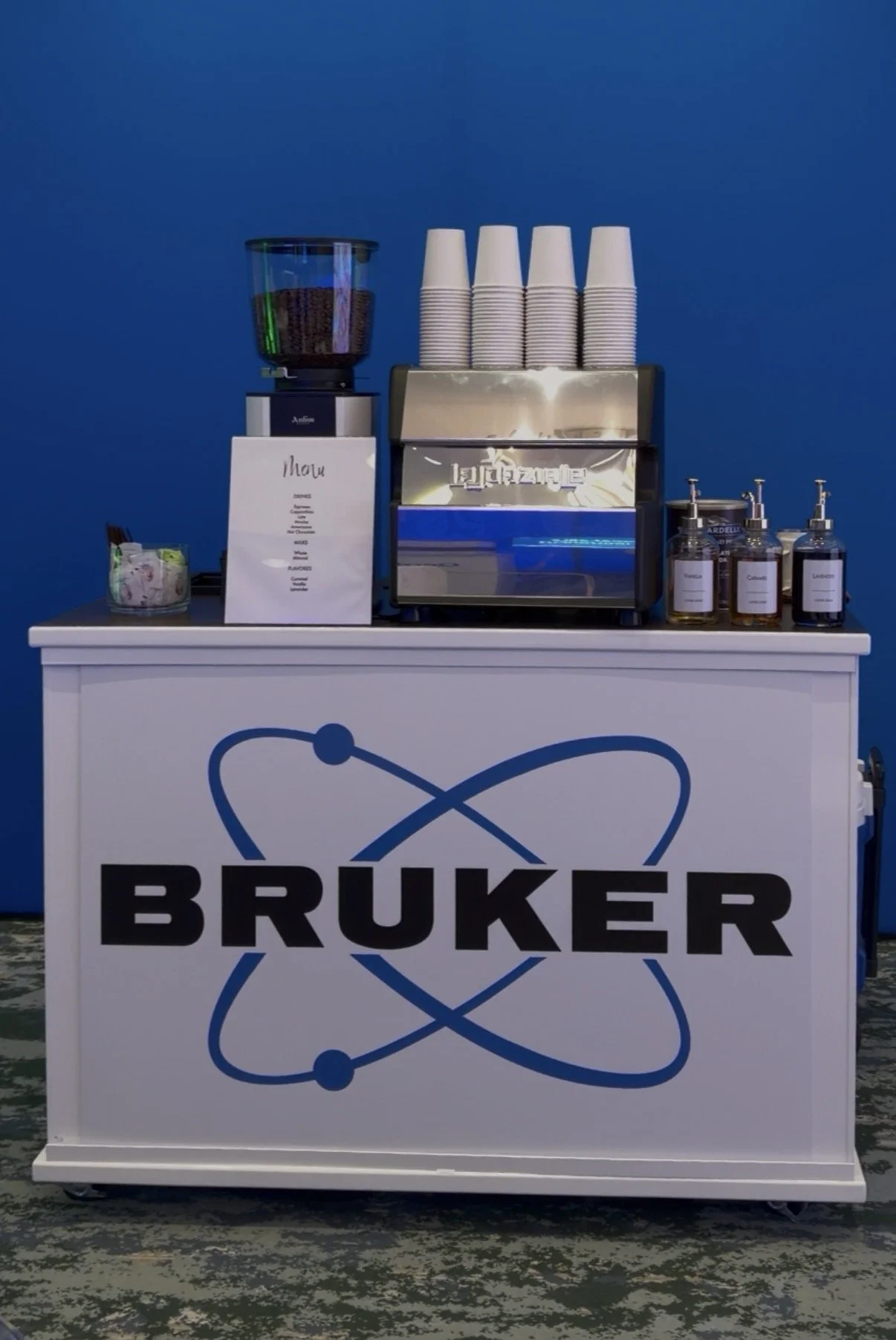 Mobile coffee cart catering service serving lattes and cappuccinos at a private event in Orlando