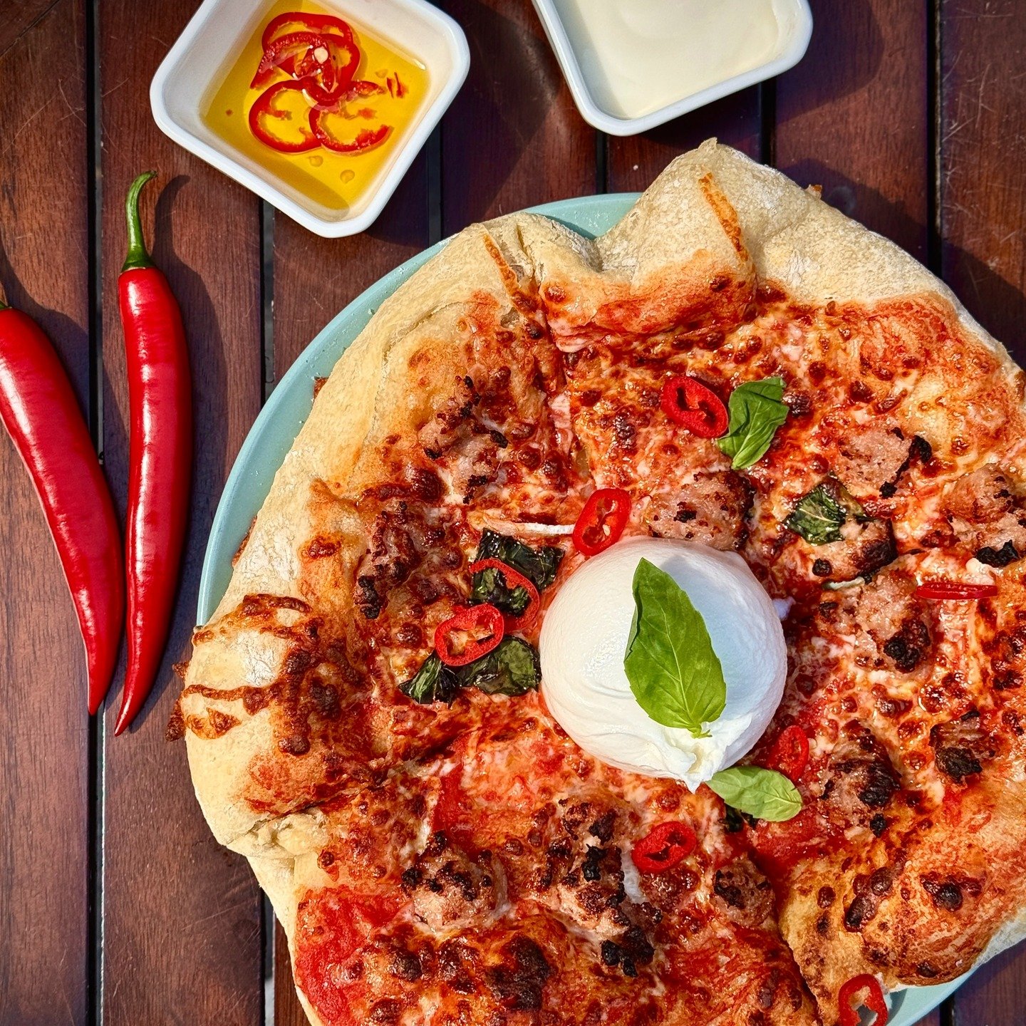This one&rsquo;s got bite.
Salsiccia. Burrata. Fresh chilli. And our homemade chilli oil to finish it off.
🔥 Taste the heat. Feel the melt.
📍Available this week &mdash; DM for bookings or party platters!
#PizzaThis #BurrataBomb #LeicesterEats #Chil