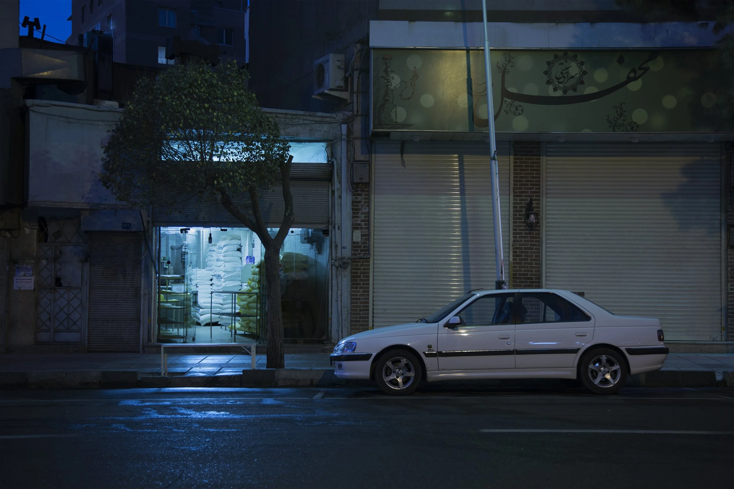 Azarbaijan Street, Tehran, 4:00 p.m., a Saturday in Khordad: Blood was flowing across the shop floor.