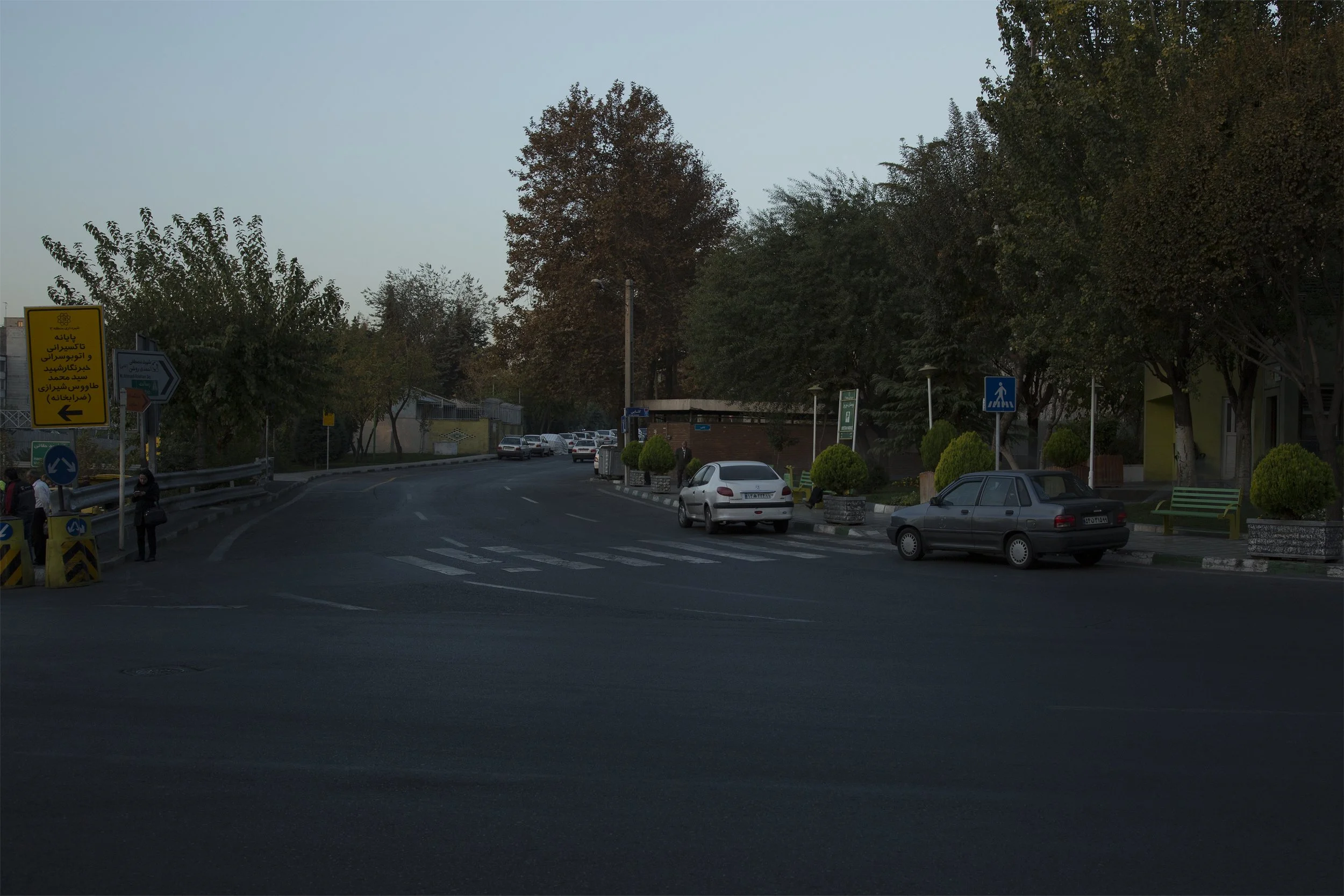 Shariati Street, Tehran, 3:00 p.m., a Sunday in Khordad: Eyes were burning, and cigarette smoke offered relief.