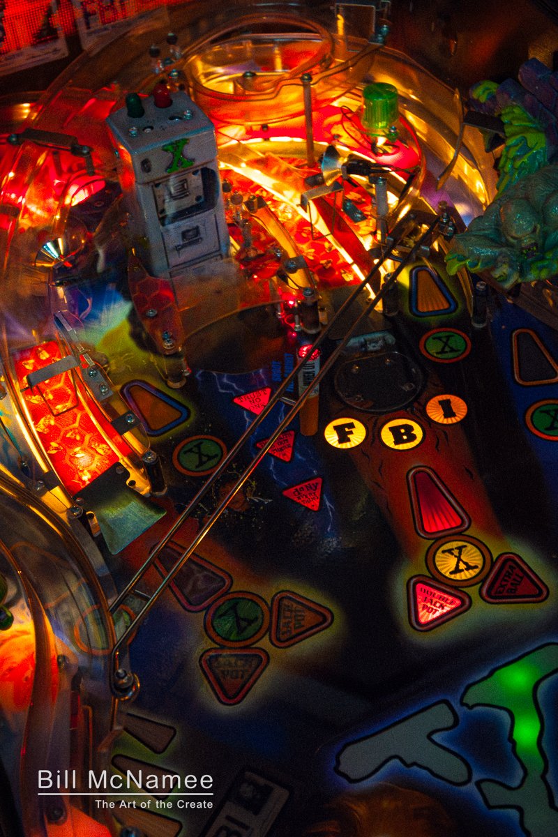 X-Files pinball machine glowing above the bowling lanes at Thunderhead Bowl & Grill