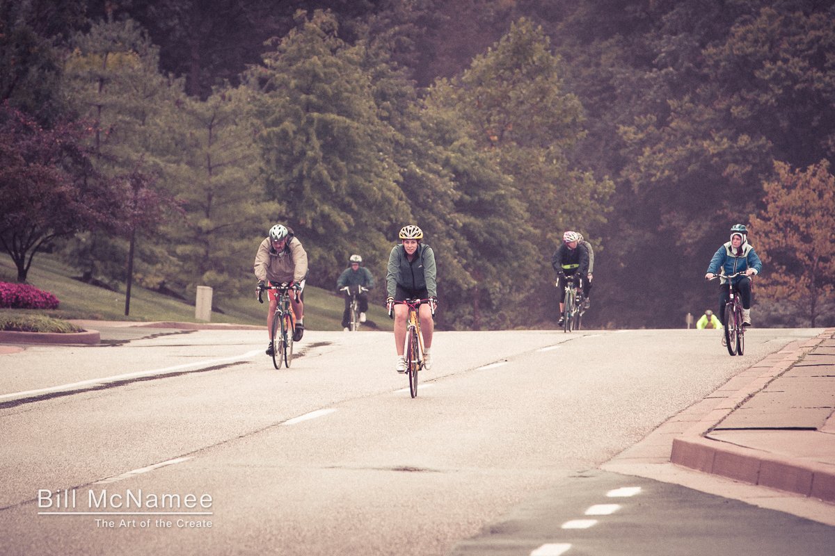 Five cyclists ride toward the camera on a wet road during the 2009 24 Hours of Booty cycling event in Columbia, Maryland.
