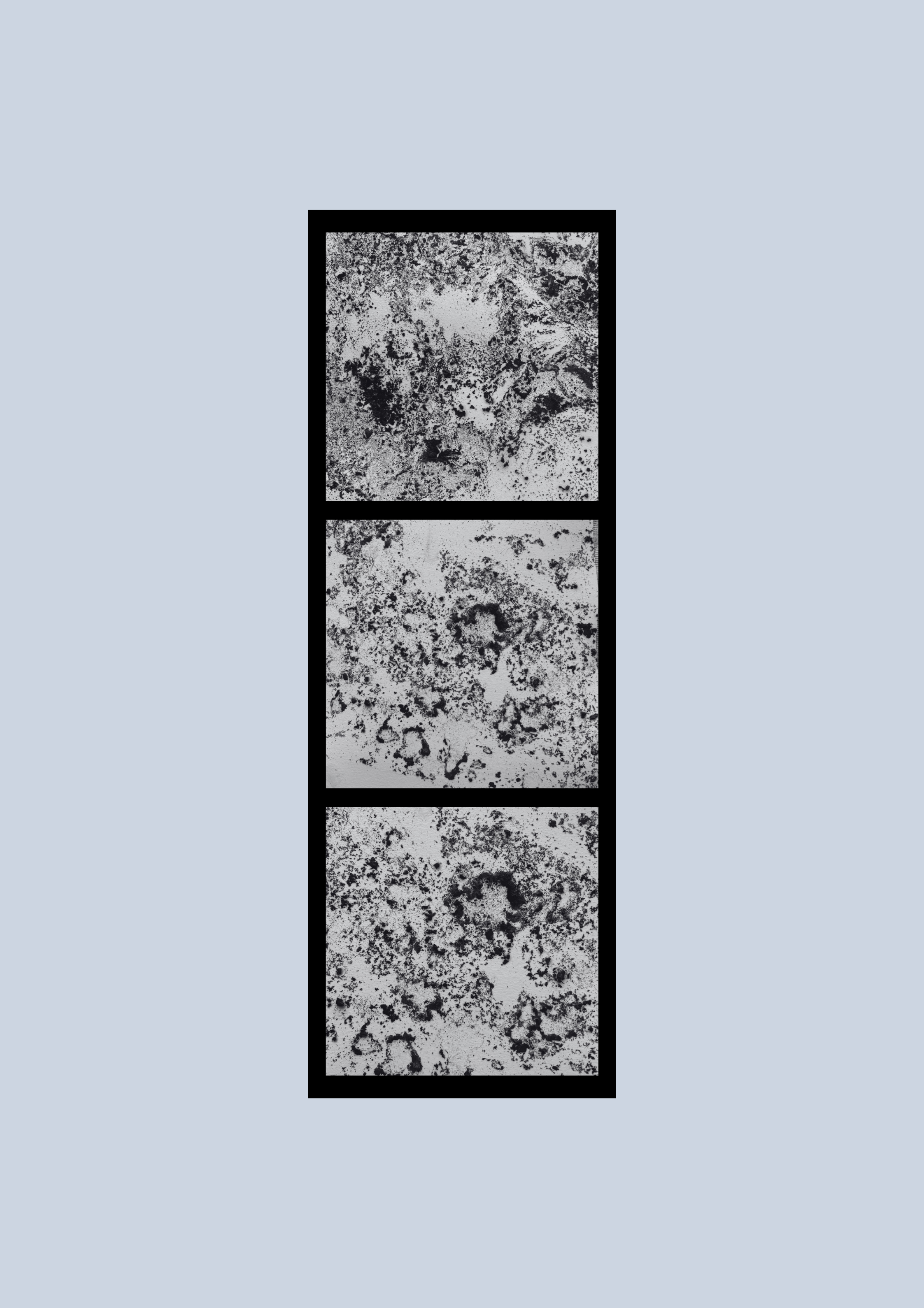 A black rectangular frame with a white marble-like textured interior, divided into four sections, set against a light blue background.