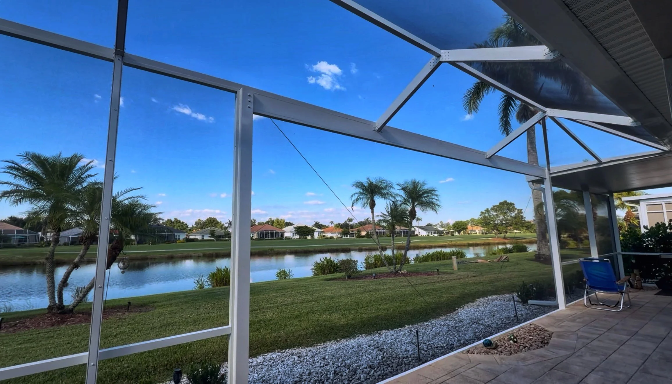 Interior Lake View – Outdoor Living Redefined

Inside the enclosure, the clear-view design creates a seamless connection between indoor comfort and the natural beauty of the surrounding lake. The structure is engineered to withstand Florida’s coastal
