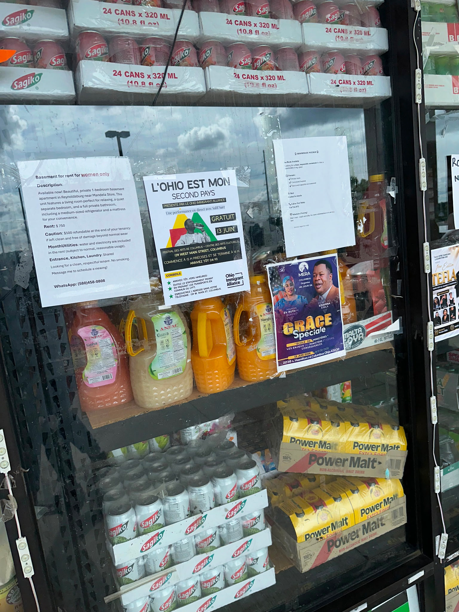 A flyer posted against a wall with groceries visible.png