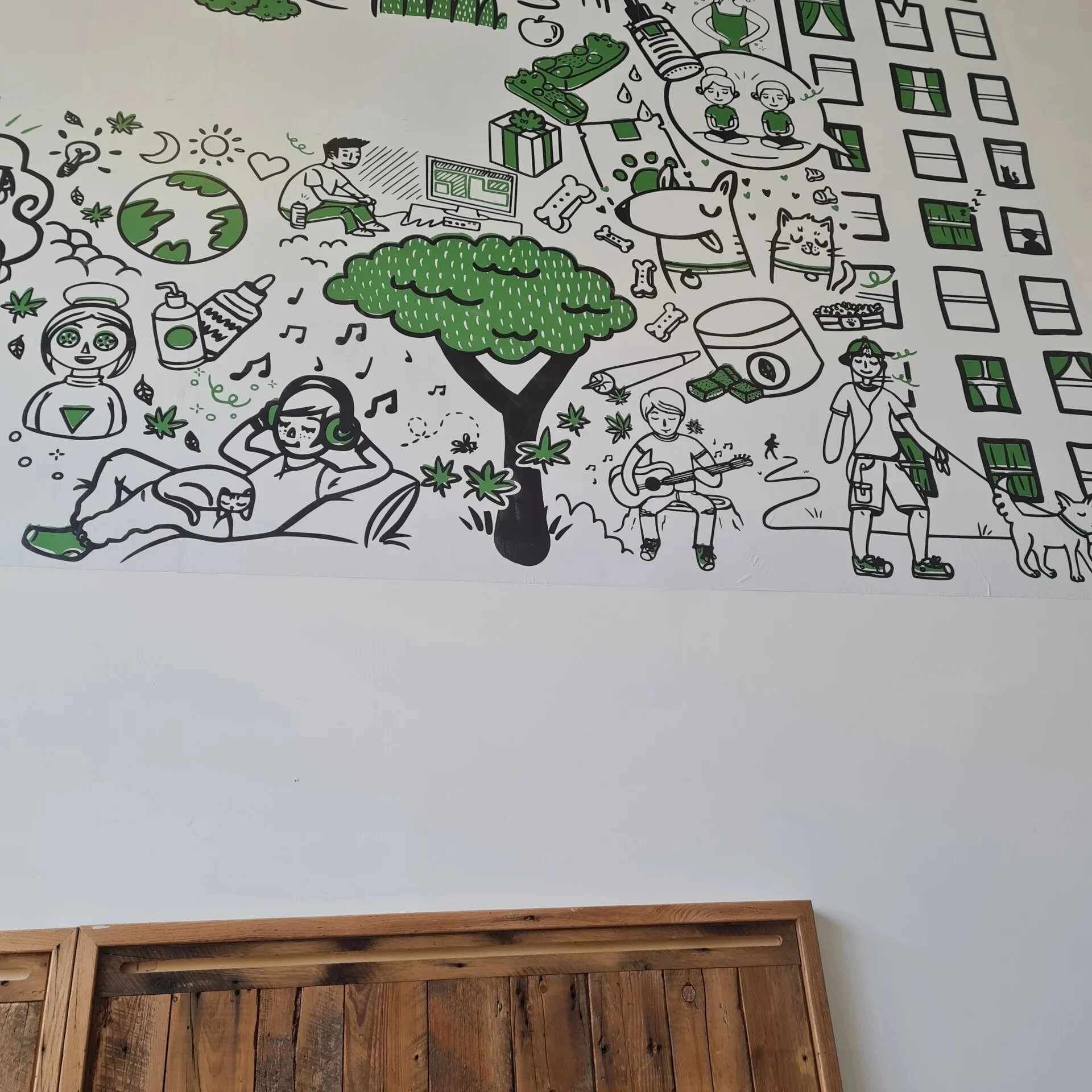 Wall mural featuring various green-themed illustrations including people, animals, trees, and objects related to nature, relaxation, and sustainability.