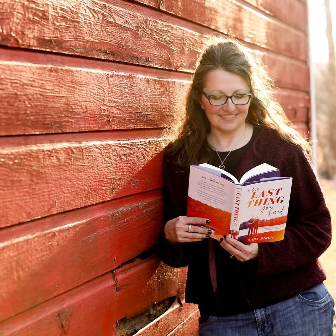 Sara Biren holds her debut novel, The Last Thing You Said