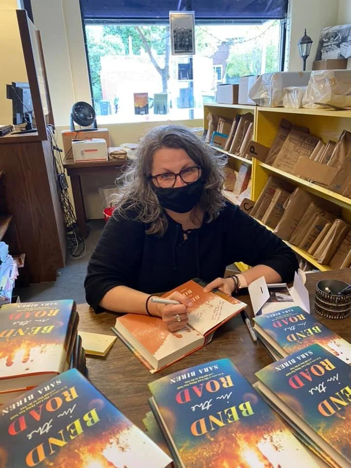 Sara Biren signs copies of Bend in the Road at Boswell Books in Milwaukee, Wisconsin, September 2021