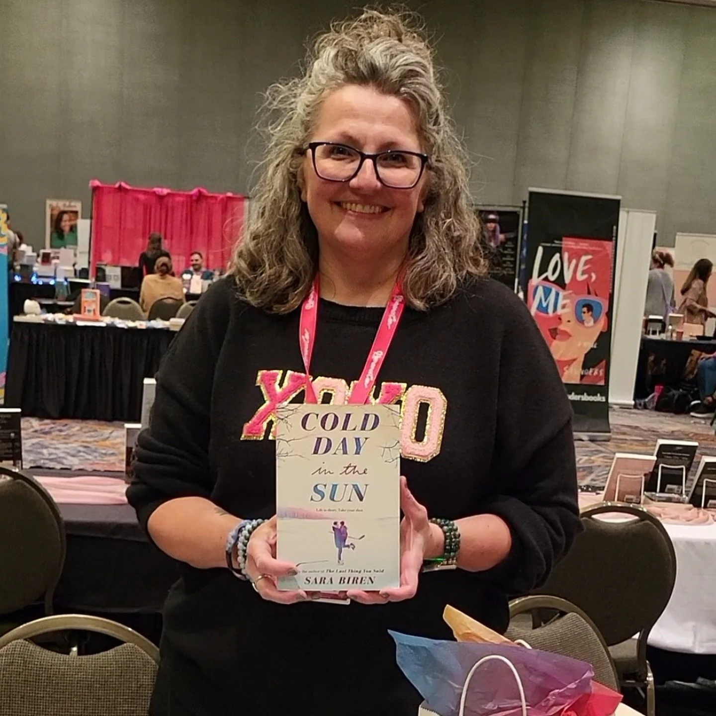 Sara Biren holds a copy of Cold Day in the Sun at a convention in Milwaukee, Wisconsin