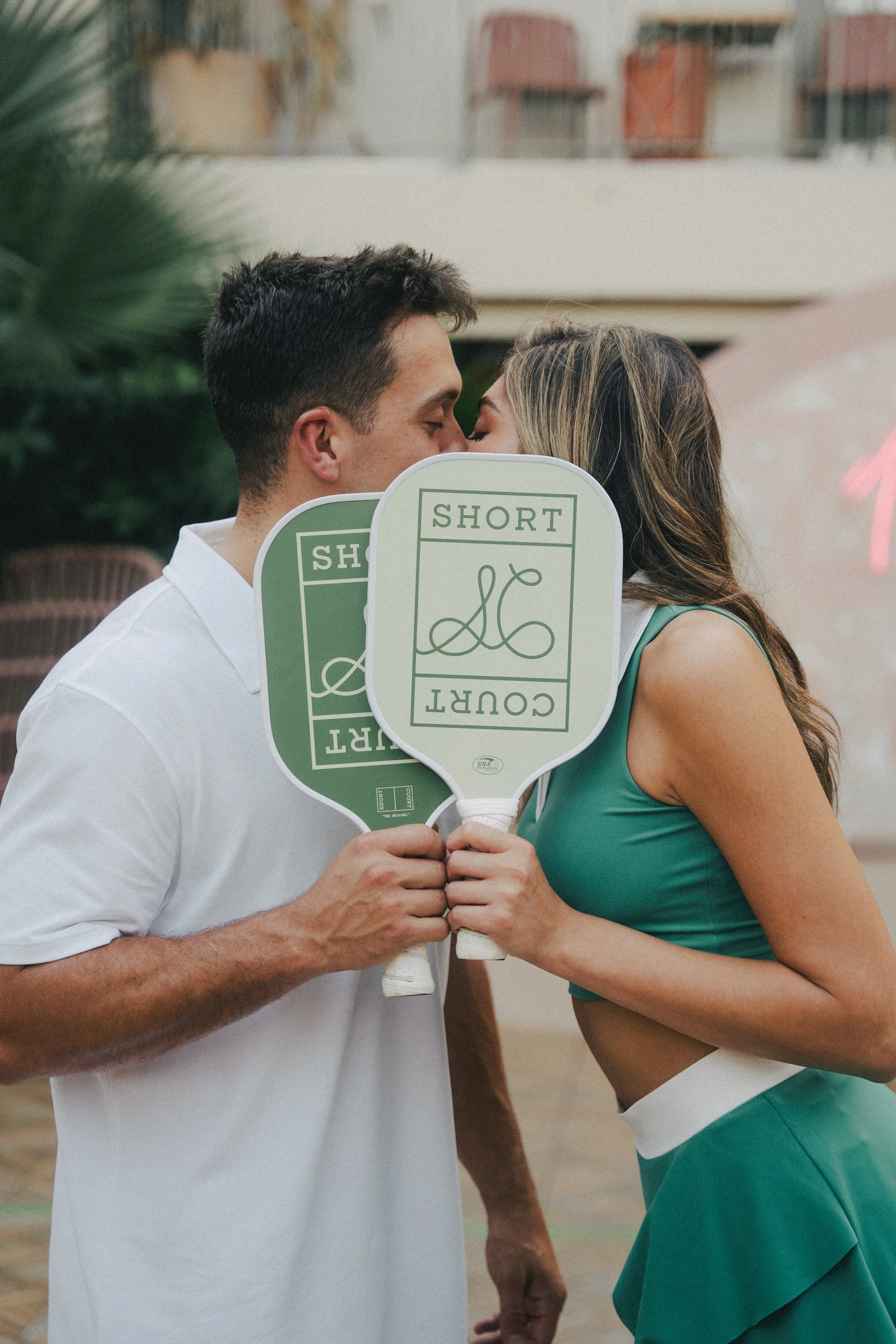charleston-ryder-hotel-pickleball-engagment-couple-kissing-carly thompson photography.jpg