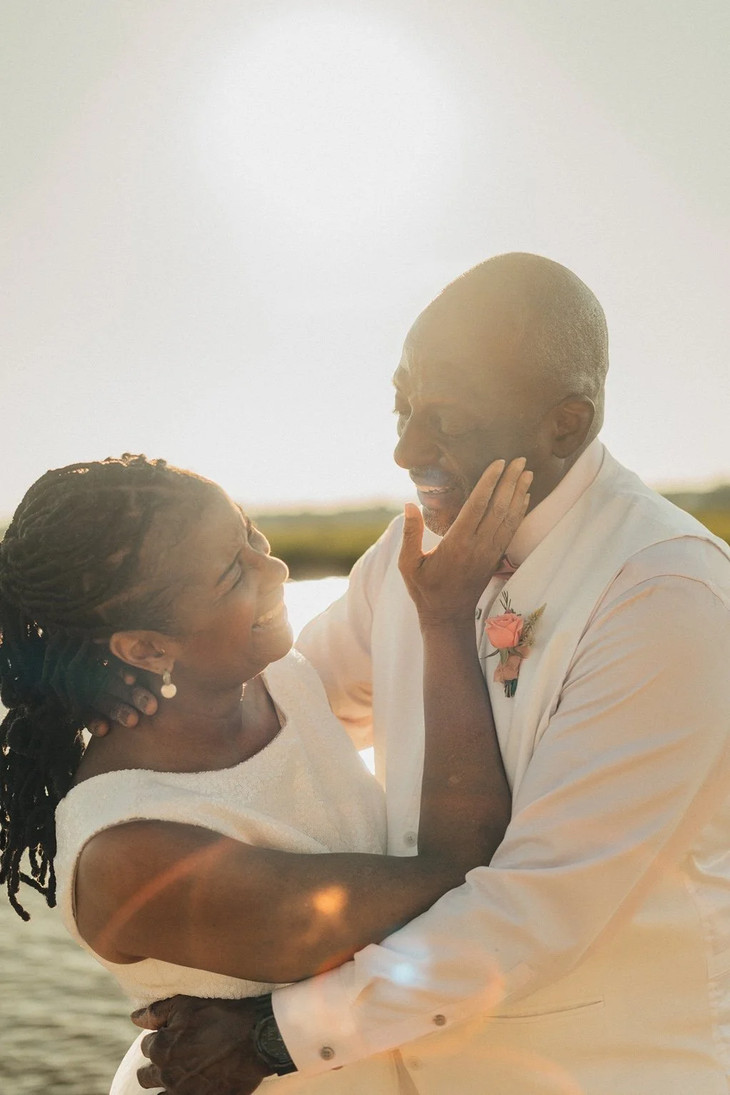 myrtle-beach-wedding-couple-smiling-laughing-golden-hour-carly thompson photography.jpg