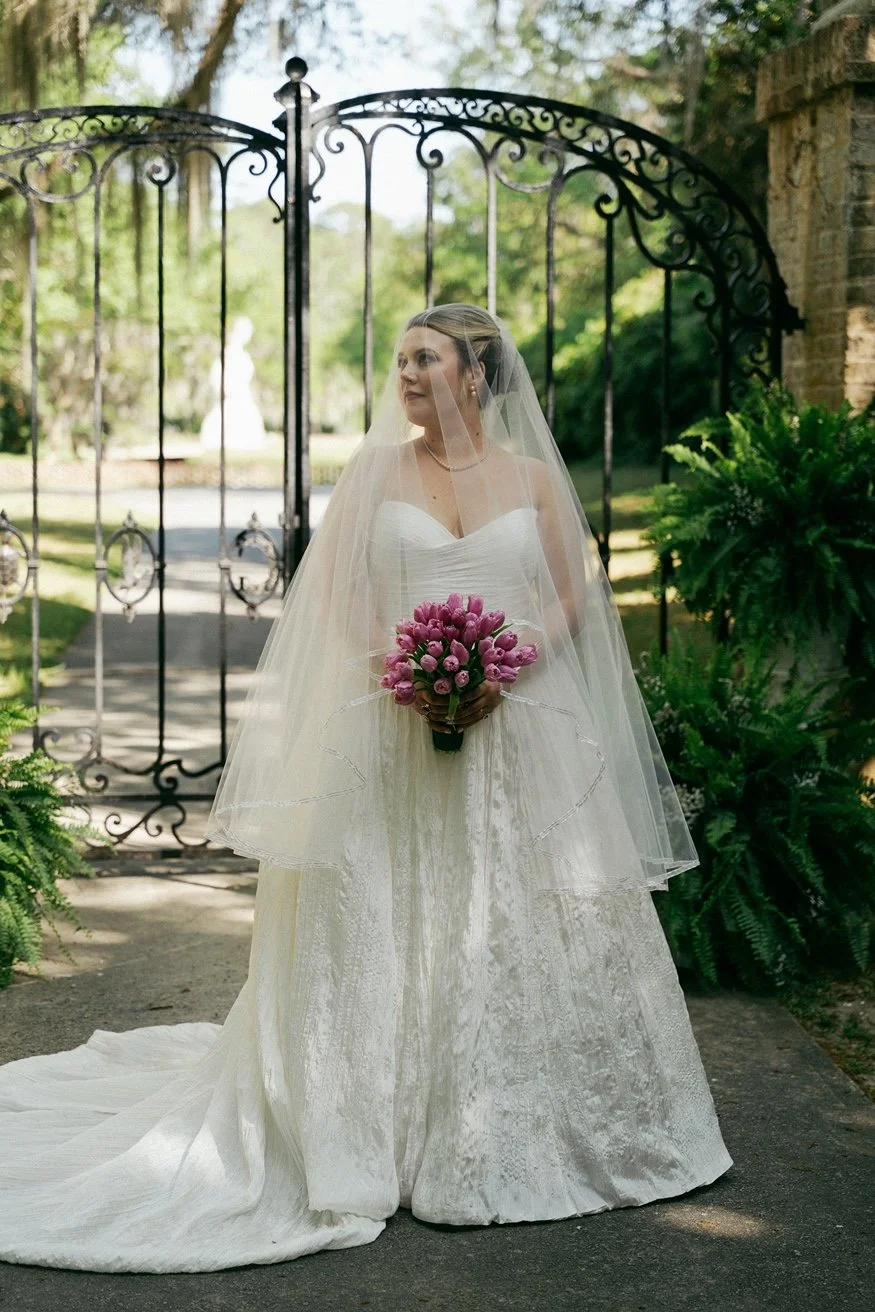 brookgreen-gardens-intimate-wedding-bride-in-front-of-gate-carly thompson photography.jpg.jpg