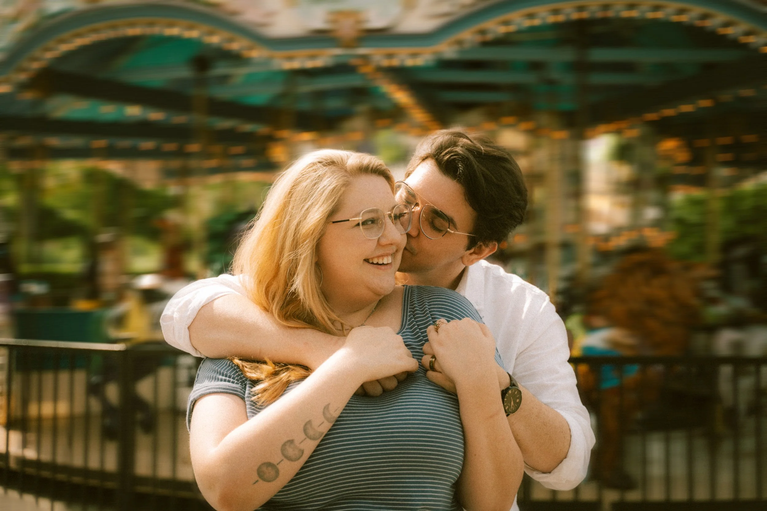 broadway-at-the-beach-myrtle-carousel-couple-kissing-engagement-carly thompson photography.jpg