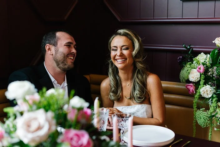 the-george-hotel-georgetown-sc-wedding-couple-laughing-dinner-carly thompson photography.jpg