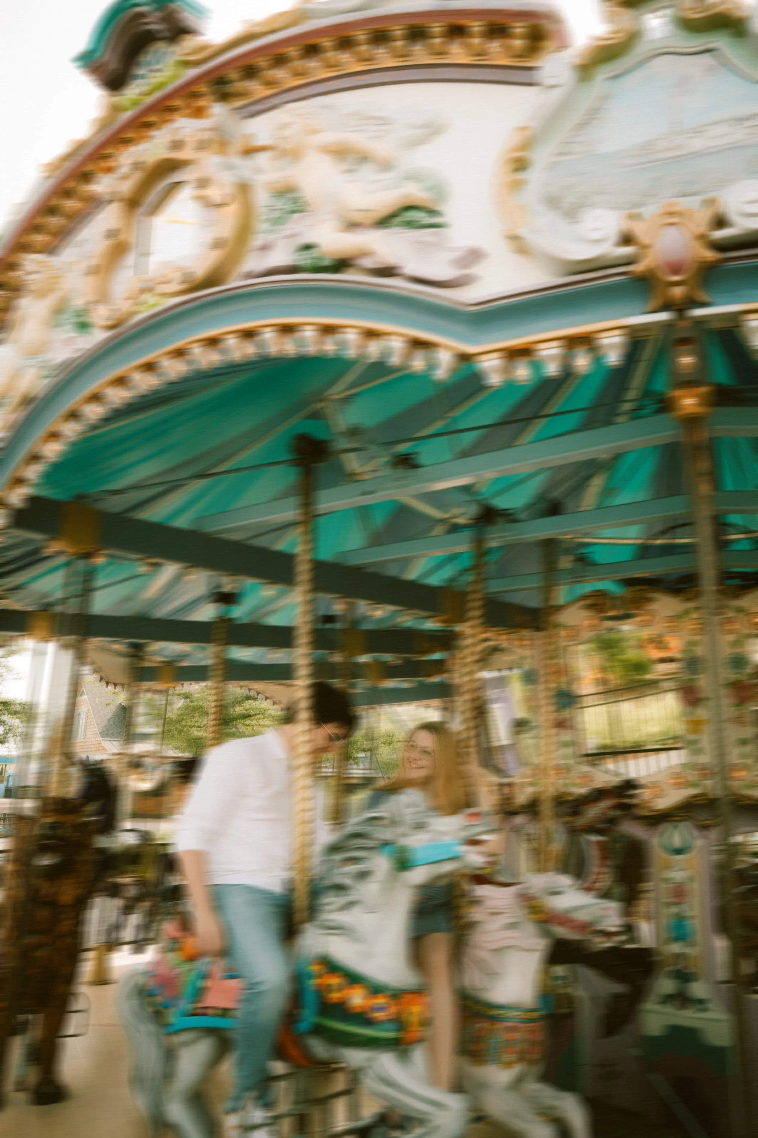 broadway-at-the-beach-myrtle-carousel-couple-engagement-carly thompson photography.jpg