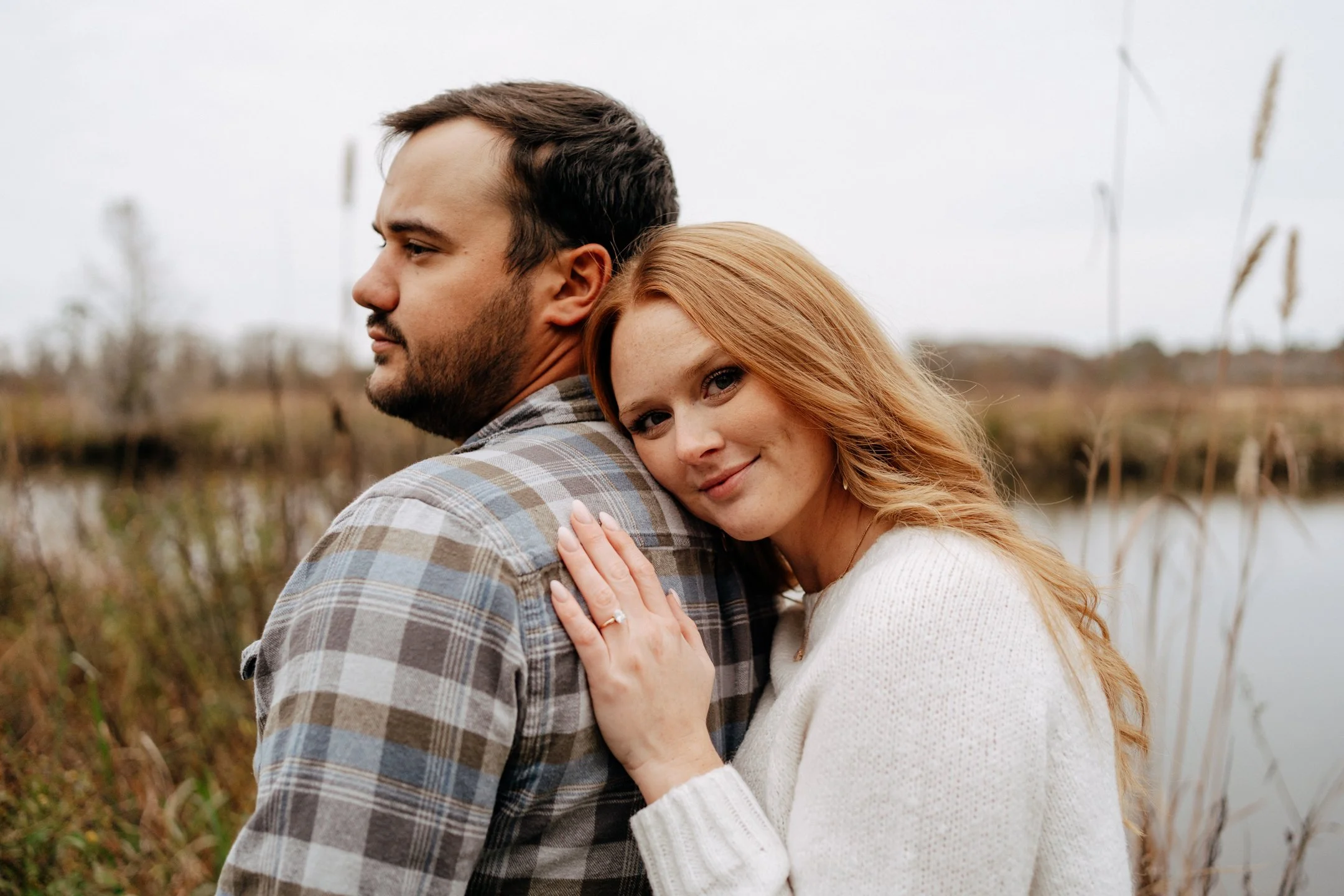 brookgreen-gardens-engagement-couple-hugging-marsh-grass-carly thompson photography.jpg