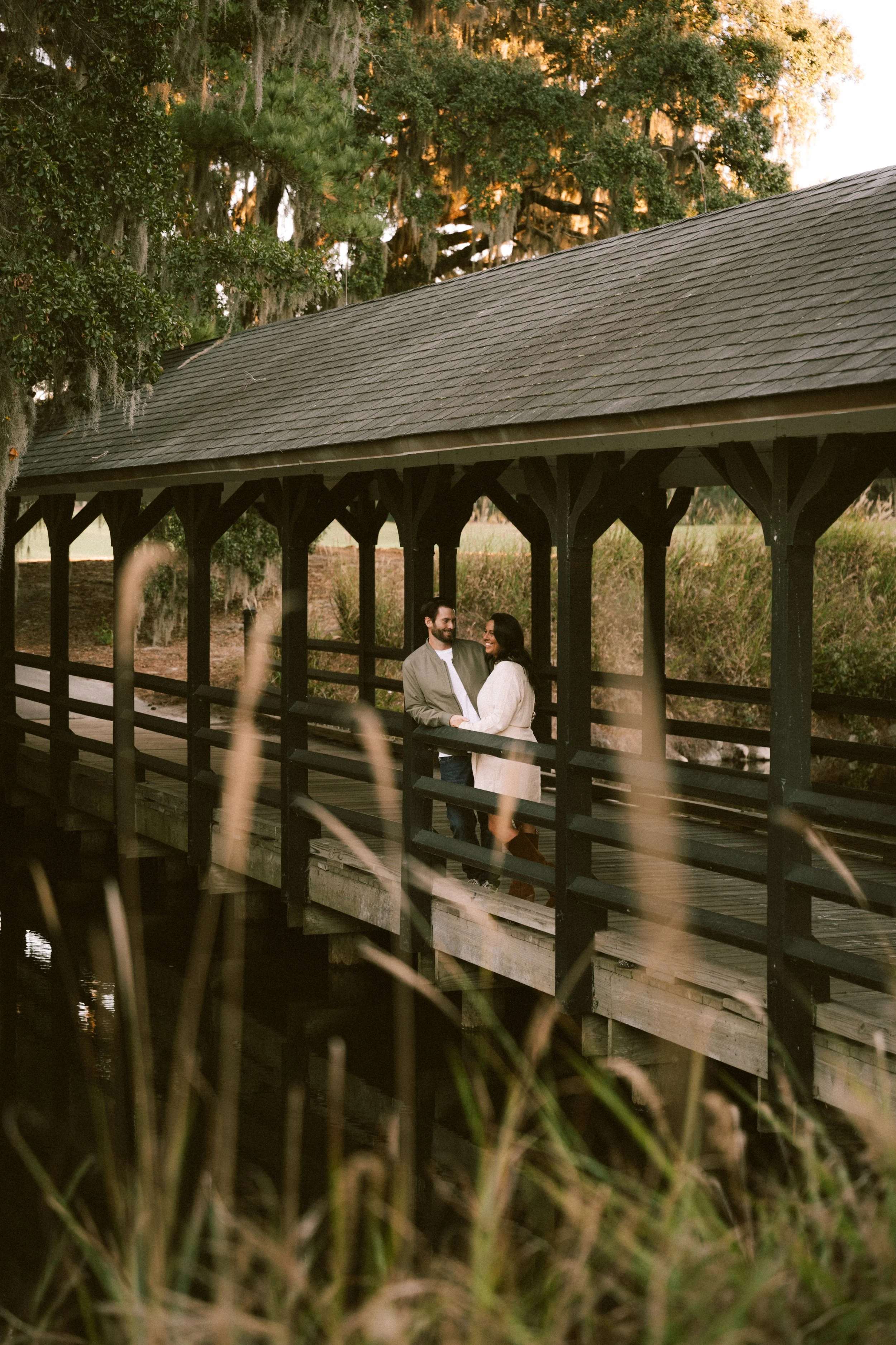 myrtle-beach-caledonia-golf-fish-club-engagement-golden-hour-couple-on-bridge-carly thompson photography.jpg
