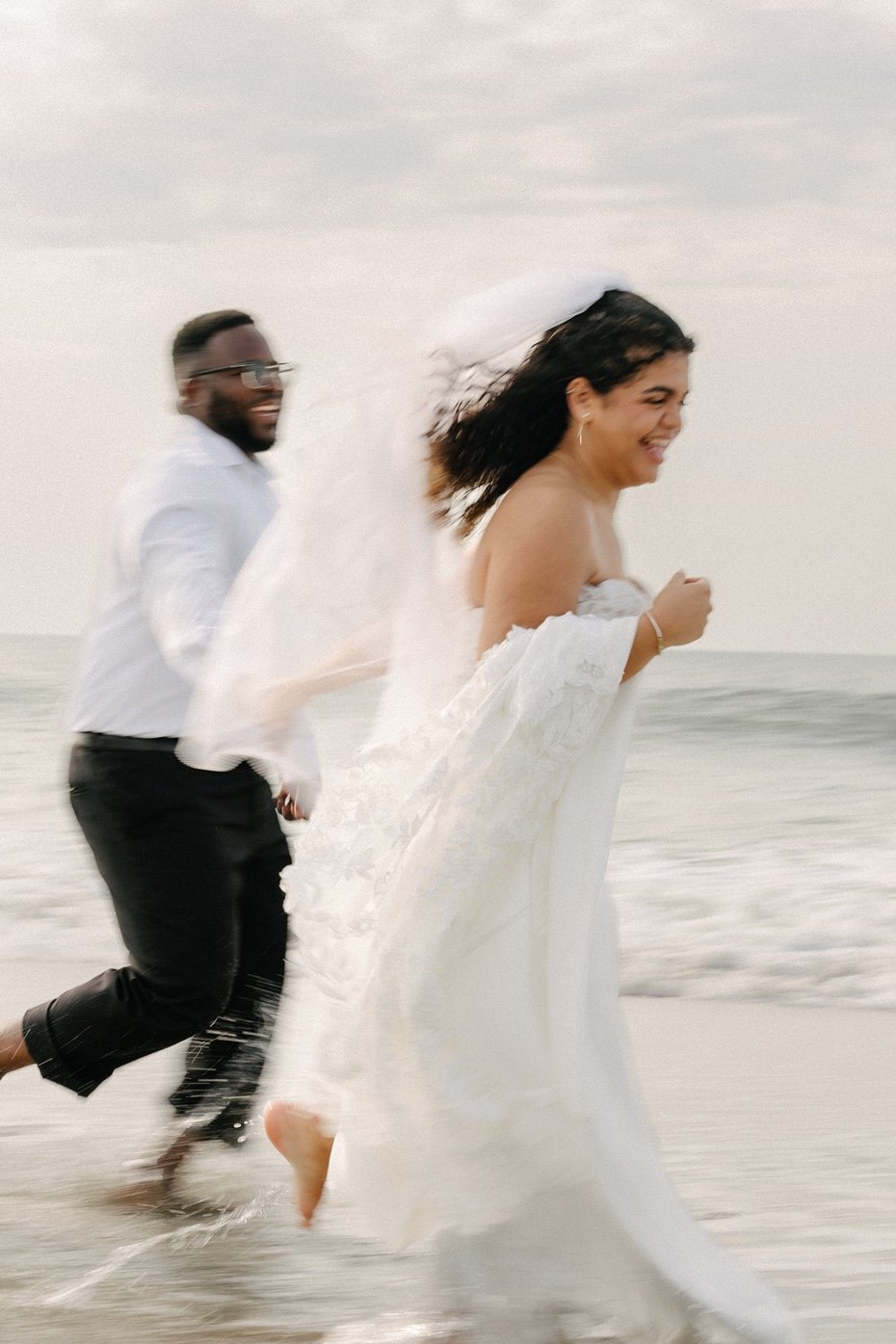 huntington-beach-state-park-myrtle-beach-elopement-running-on-beach-carly thompson photography.jpg