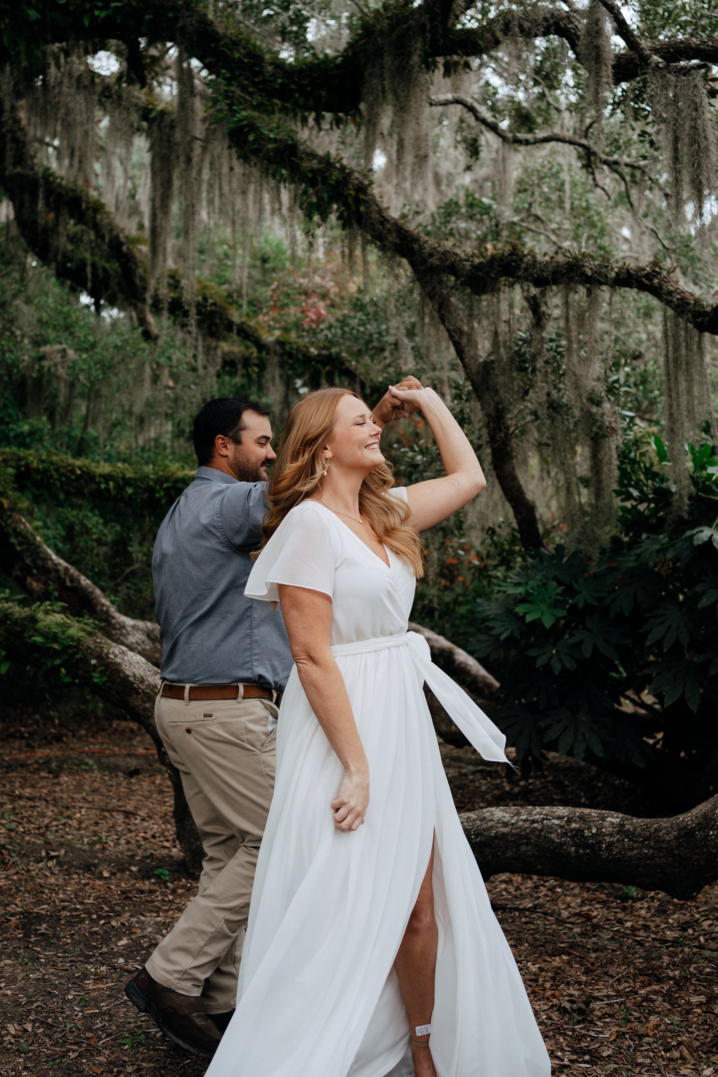 brookgreen-gardens-engagement-couple-dancing-forest-oak-carly thompson photography.jpg