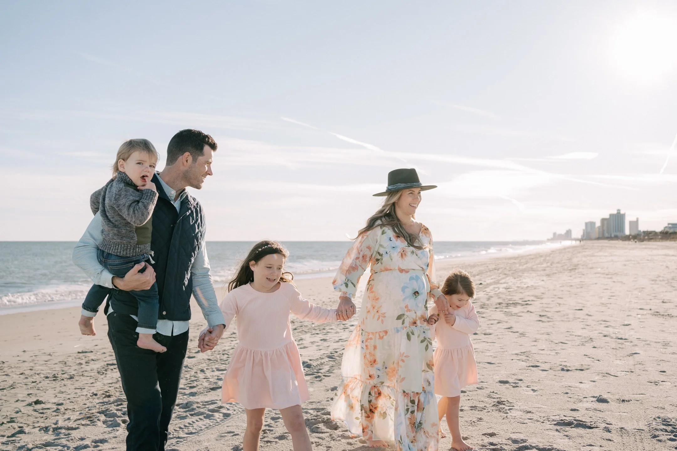 myrtle-beach-family walking-sunset-carly thompson photography.jpg