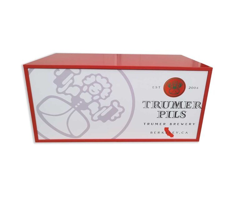 Red display box for Trumer Pils beer from Trumer Brewery in Berkeley, California, established in 2004.