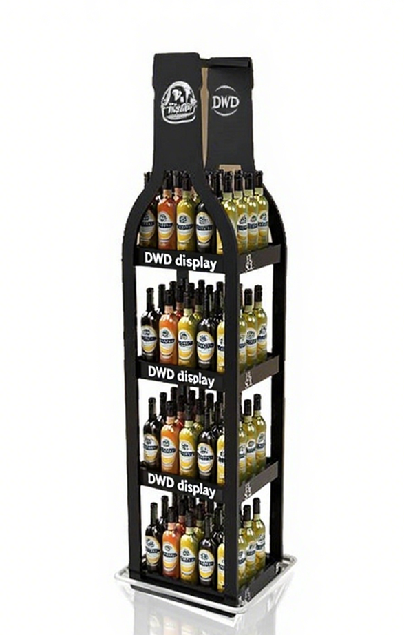 A retail display stand filled with bottles of hot sauce arranged on multiple shelves.