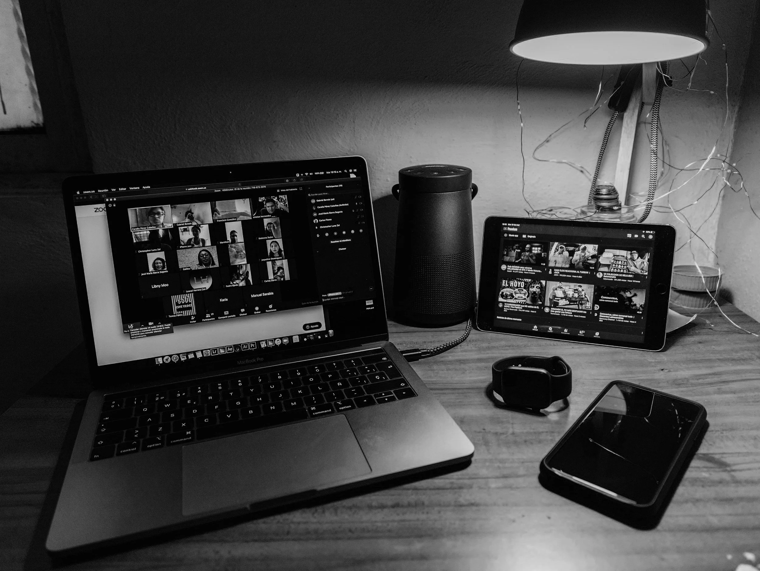 two devices on desk with other items