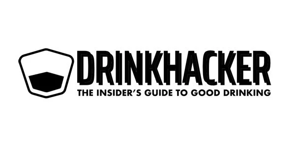 Black and white logo for Drinkhacker with a glass icon and the tagline 'The insider's guide to good drinking'.