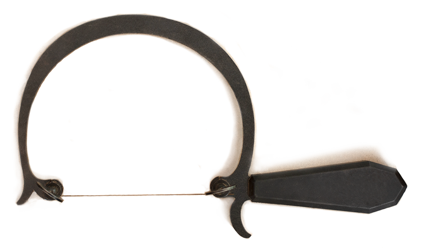 A black silversmithing tool for cutting metal to make jewellery.