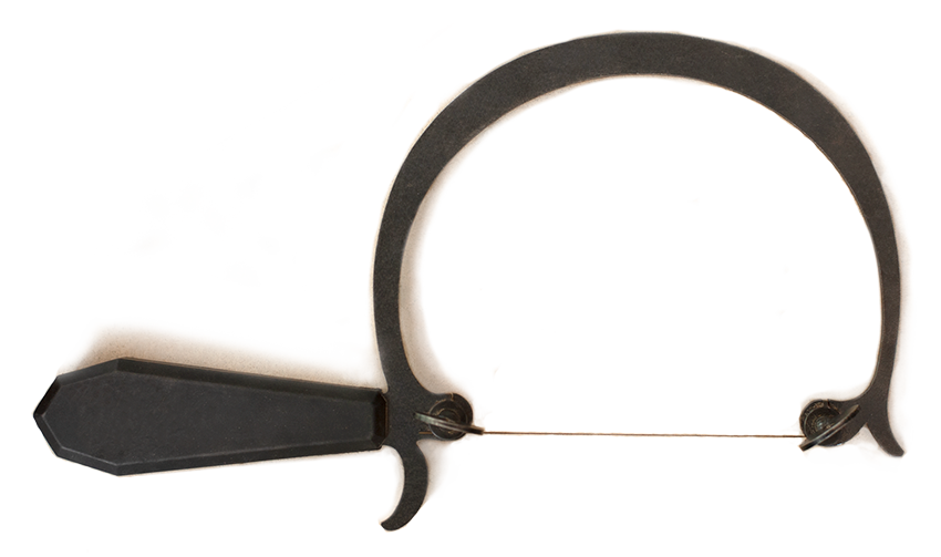 A close-up view of a suture needle with a curved, sharp tip, metal shaft, and attached black handle for surgical suturing.