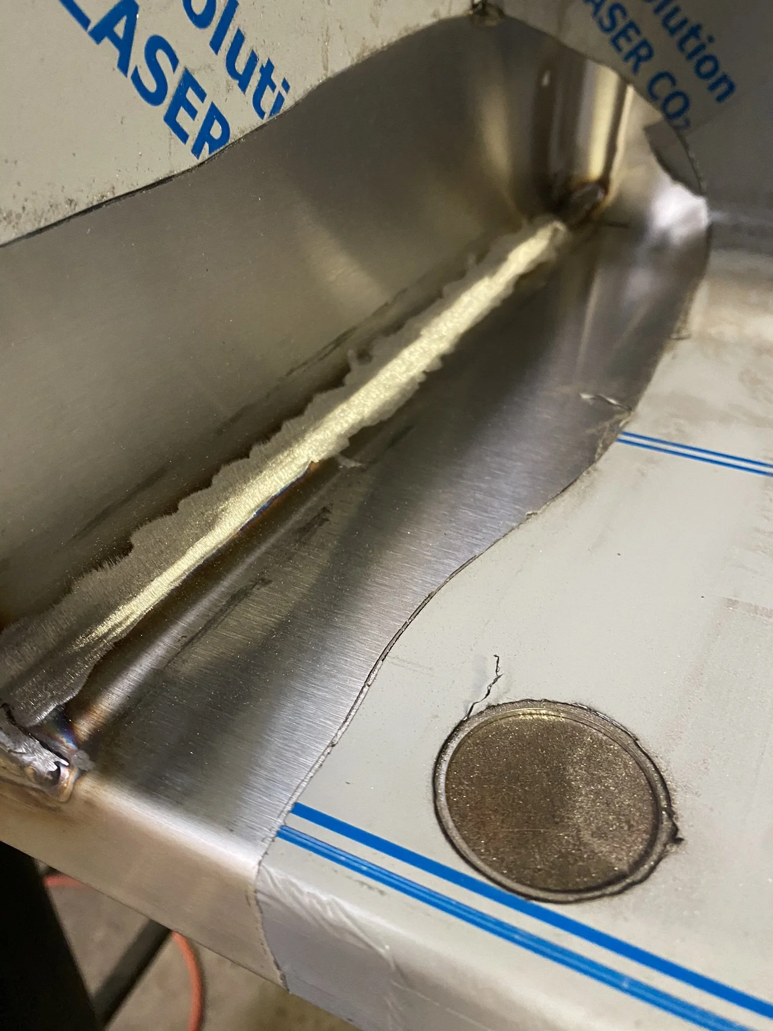 polishing process of refinishing the grain on stainless steel inside corner of sink