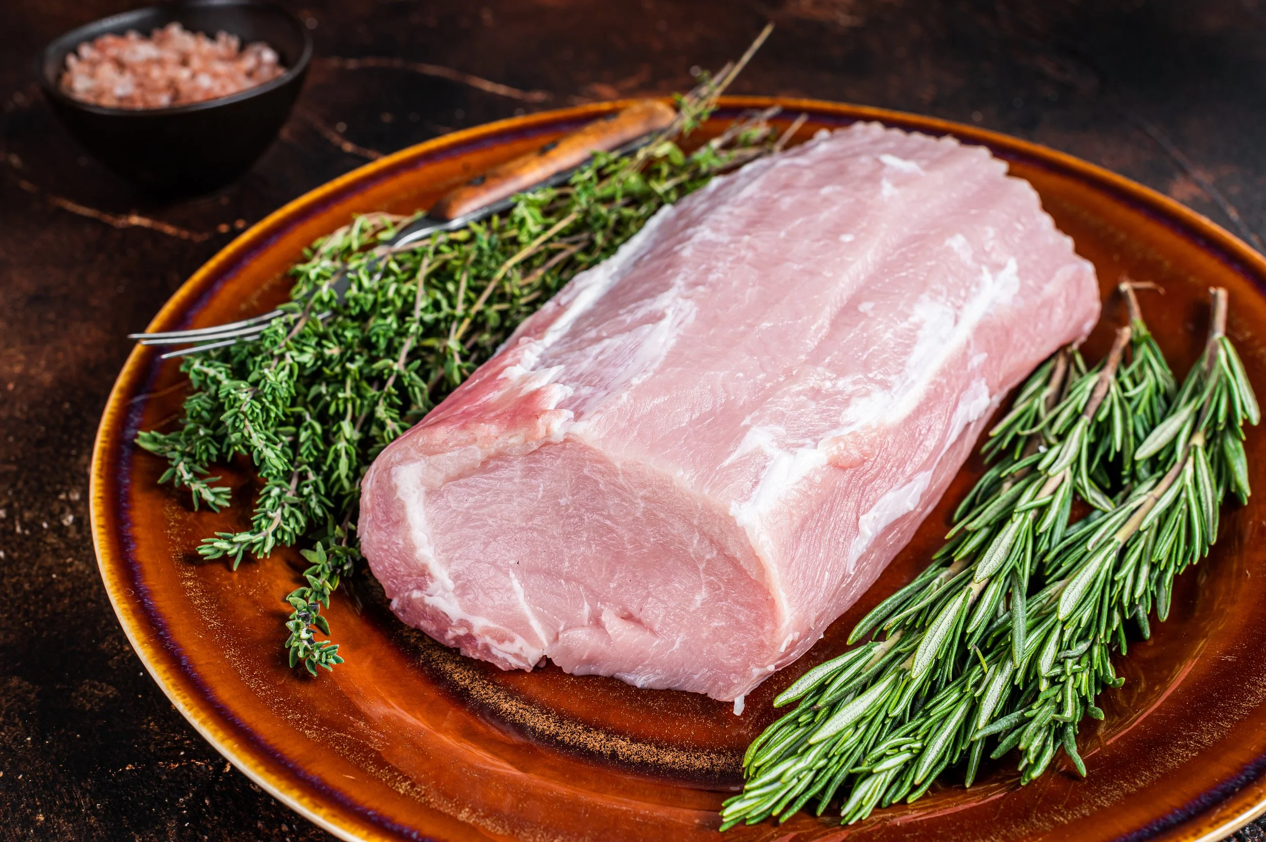 fresh-raw-pork-loin-meat-with-thyme-and-rosemary-o-2024-12-09-03-55-28-utc.JPG