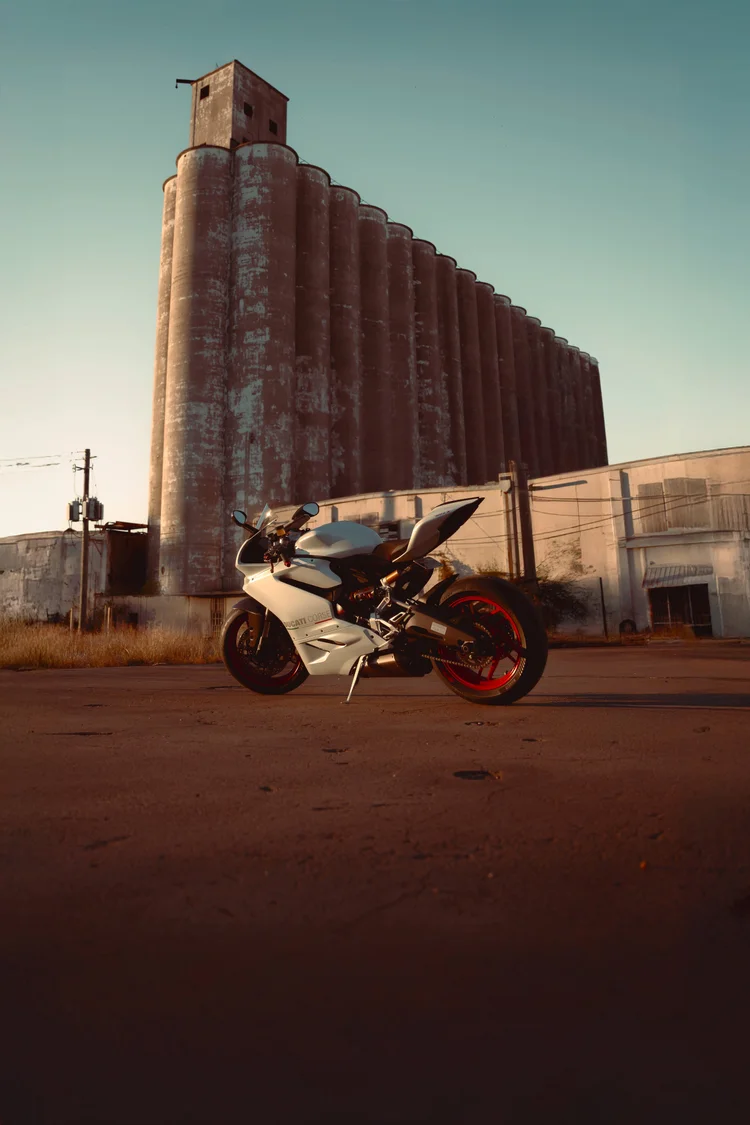 White Ducati Panigale motorcycle photography at golden hour in Houston