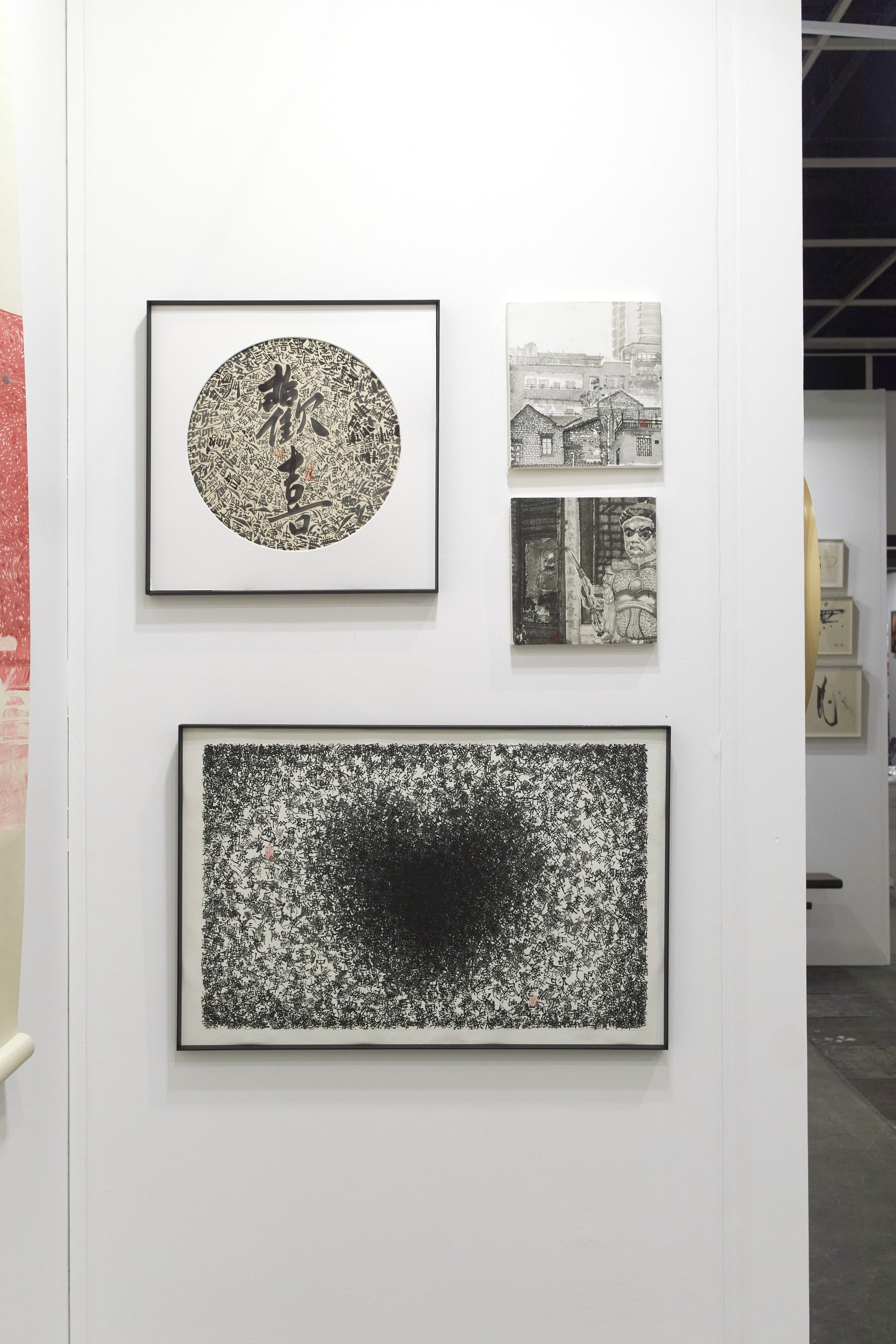 Affordable Art Fair 2025: Art gallery wall featuring five black and white artworks, including calligraphy, landscape, and abstract pieces.
