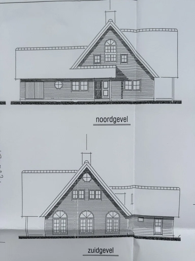 Architectural drawing of a house showing two elevations: north and south views, with detailed roof, windows, and doors.