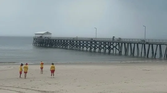 Little beach walk? 
On second thoughts … ⛈️ 
Pink Patrol staying safe and revising first aid under shelter today ⛑️