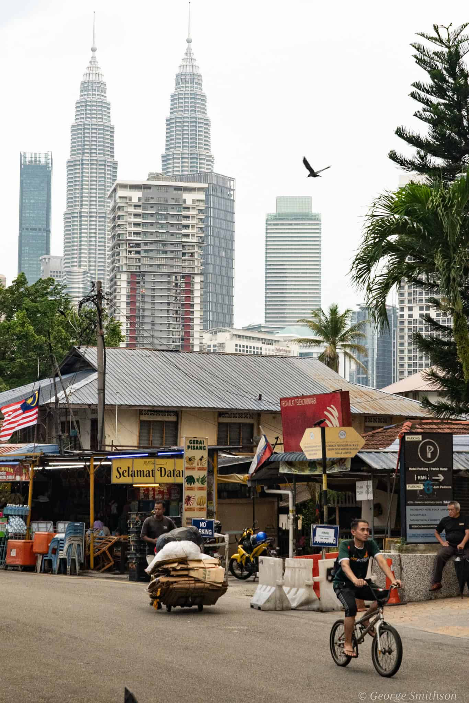 Busy neighbourhood behind the glamour of Kuala Lumpur, Malaysia. 2024.