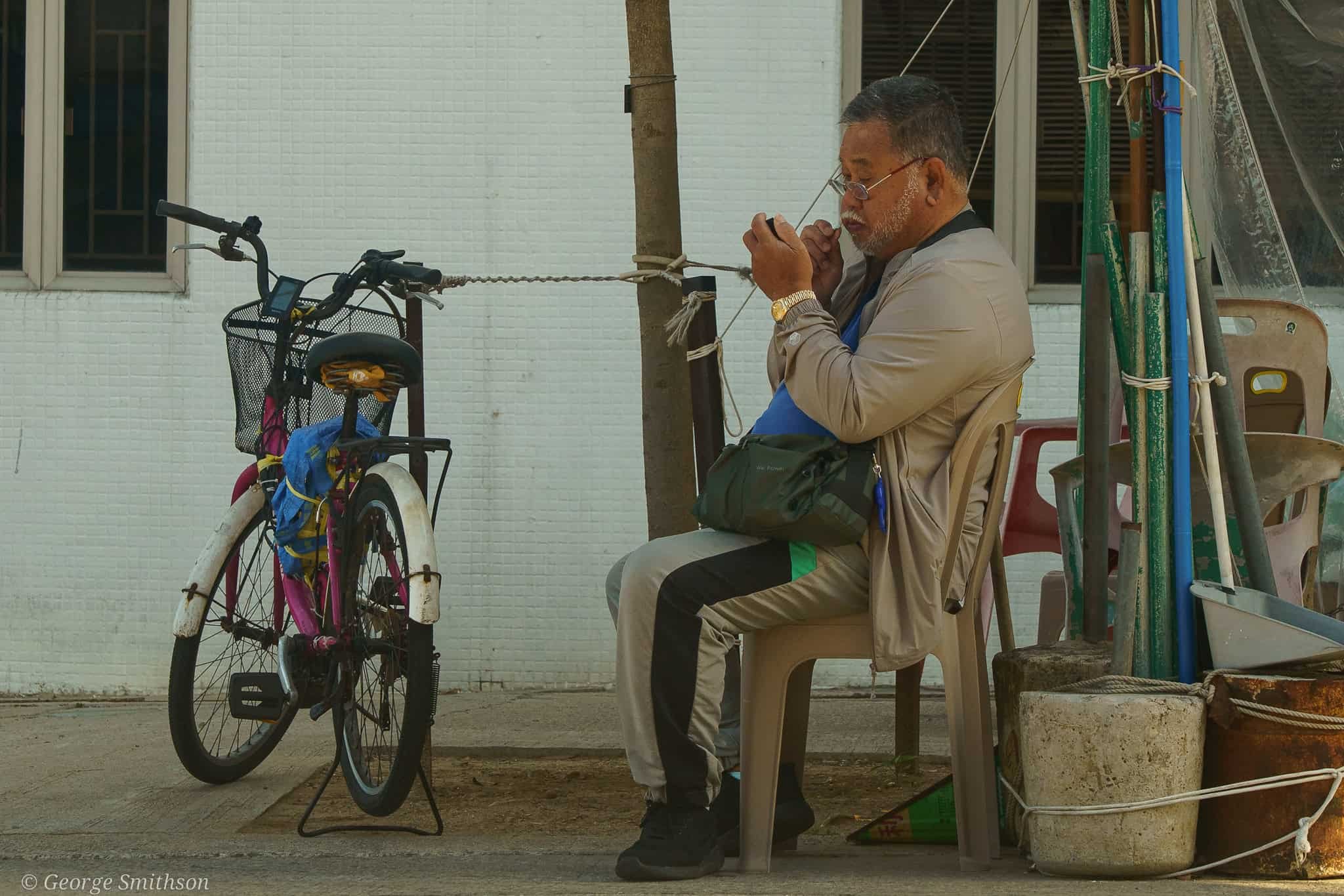 Daily groom before his friends arrive. Cheung Chau, Hong Kong.