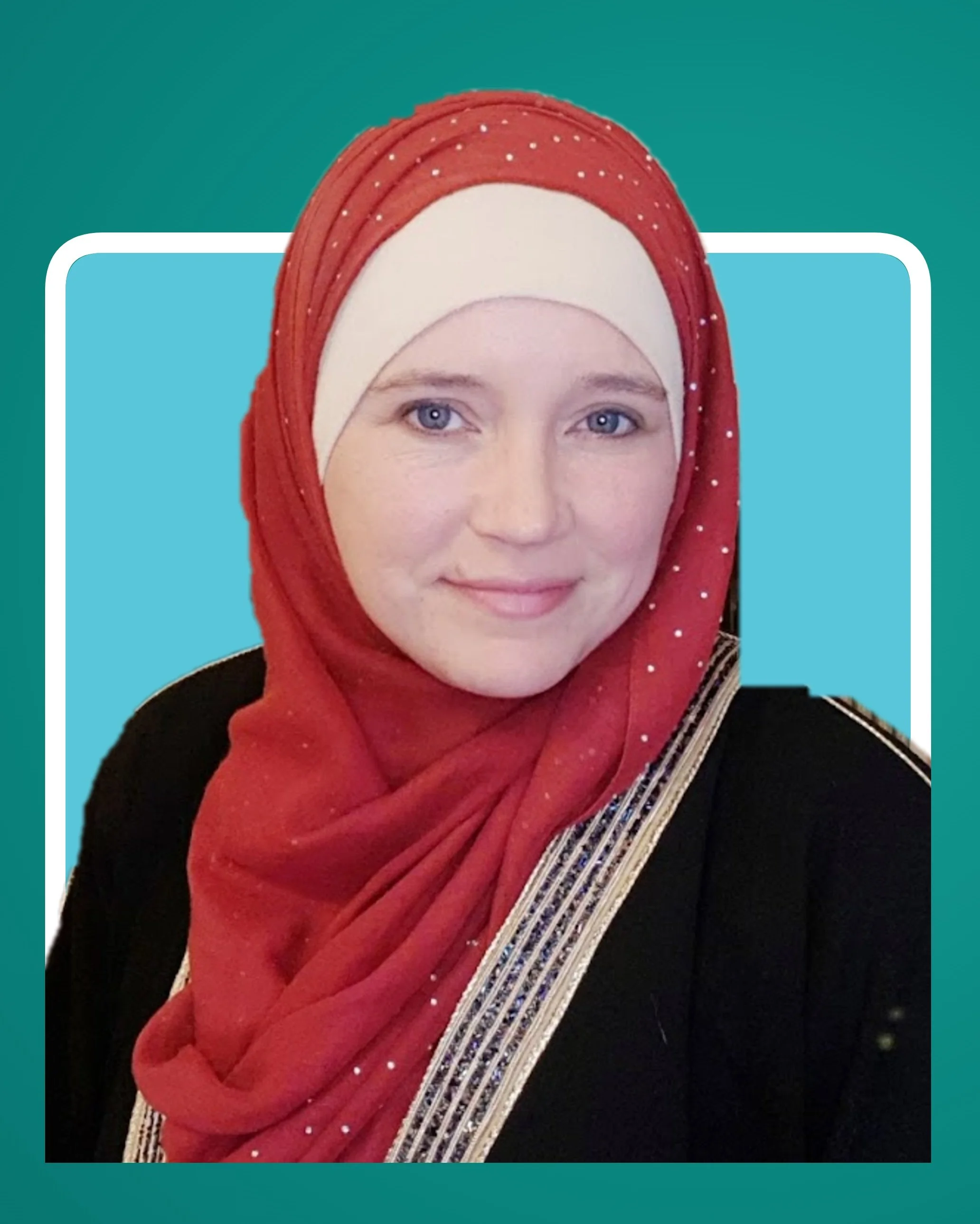 Ustadha Ameena Blake smiling, wearing a red patterned hijab and a black abaya.