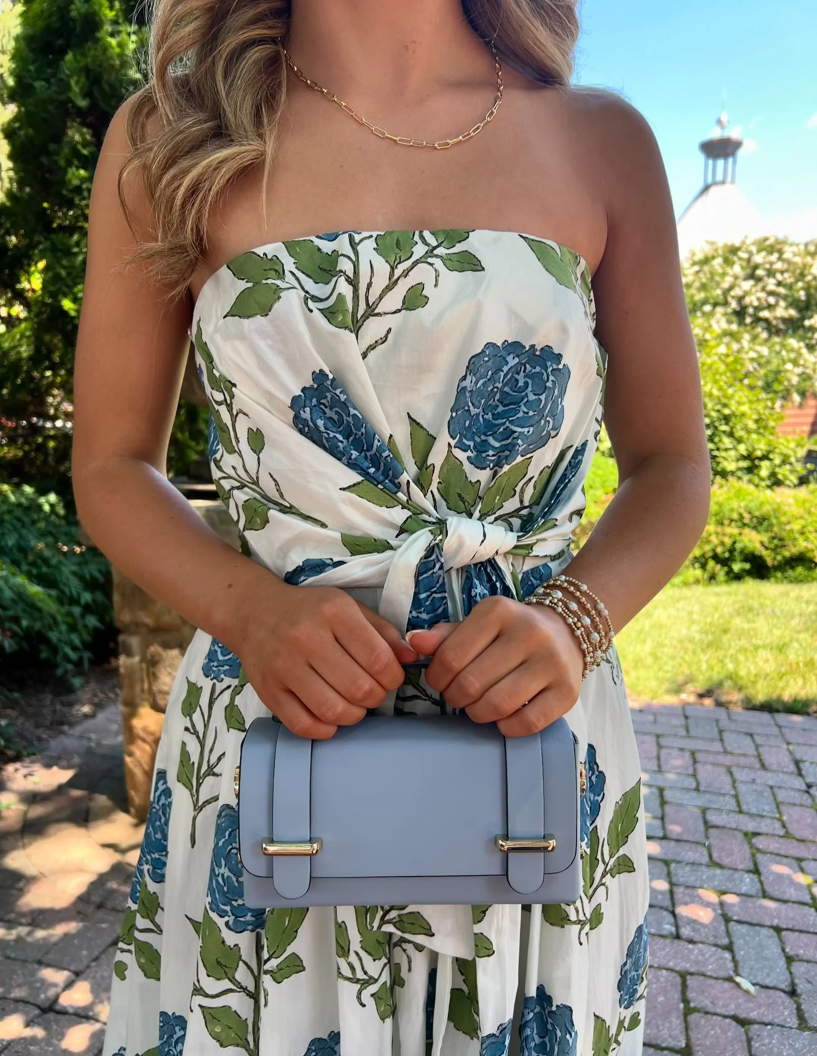 The dress. The bag. The moment🤍🩵
Soft florals, flattering details, and the perfect touch of powder blue! We can&rsquo;t get enough of this pairing for summer events, showers, brunches, and everything in between.

Available now in-store! ✨ #dressedi