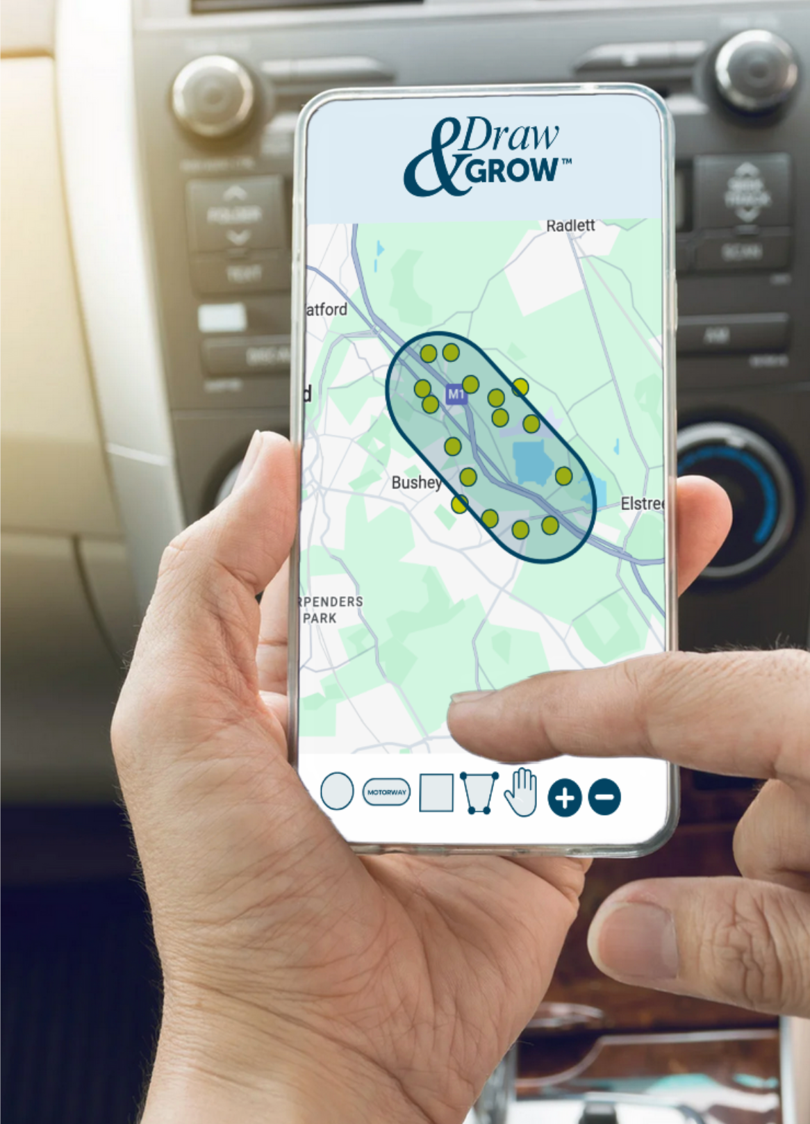A person holding a smartphone displaying a map with Draw & Grow app, showing a designated planting area and multiple yellow dots representing planting locations, with navigation buttons at the bottom.