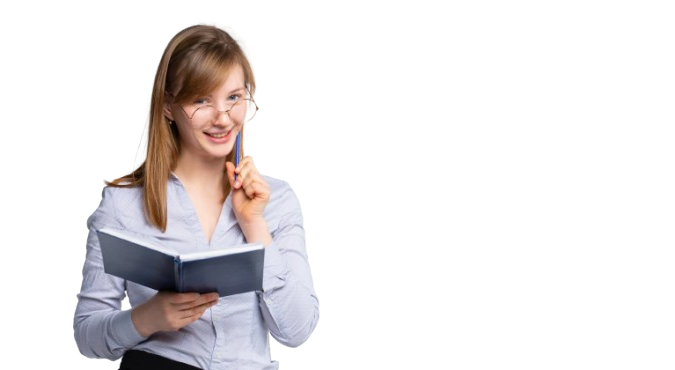 A young woman with glasses and long hair, holding a notebook and smiling while touching her glasses.