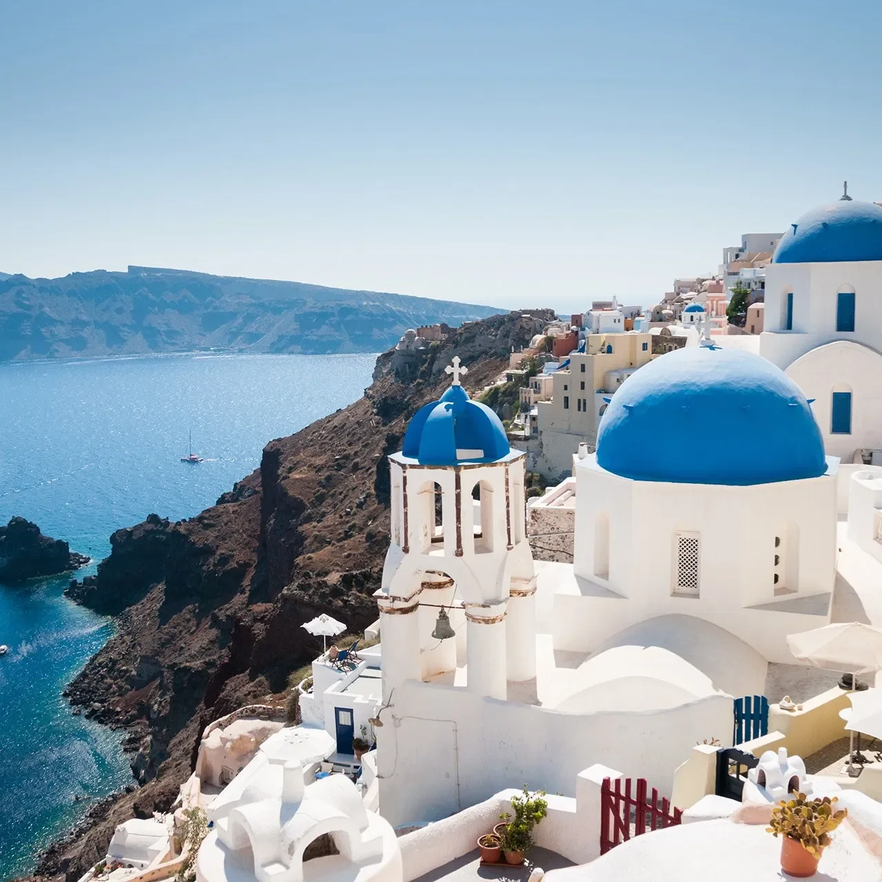 Blue-domed-church-along-caldera-edge-in-Oia-Santorini-greece-conde-nast-traveller-11aug17-iStock.webp