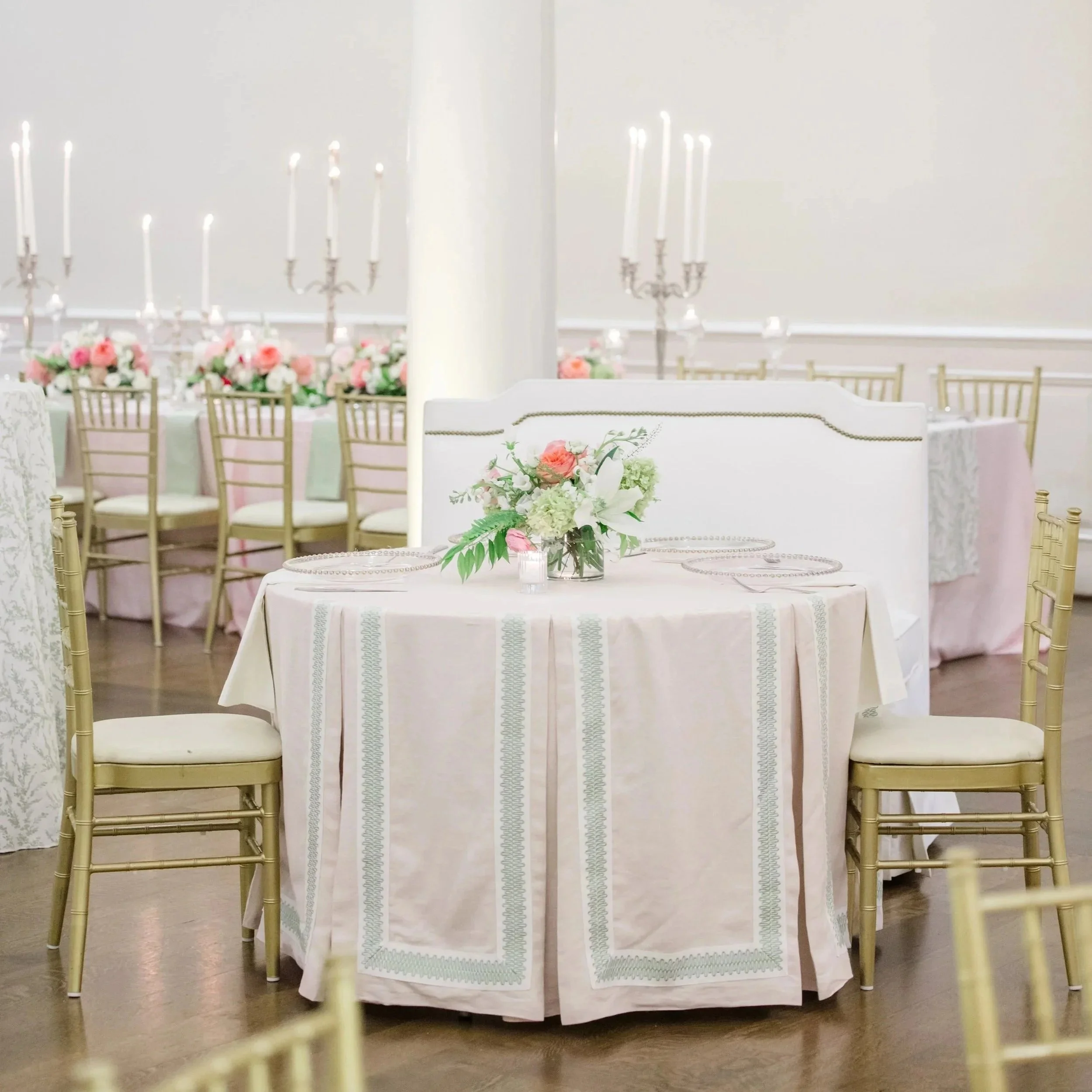pink box pleated with green trim tablecloth