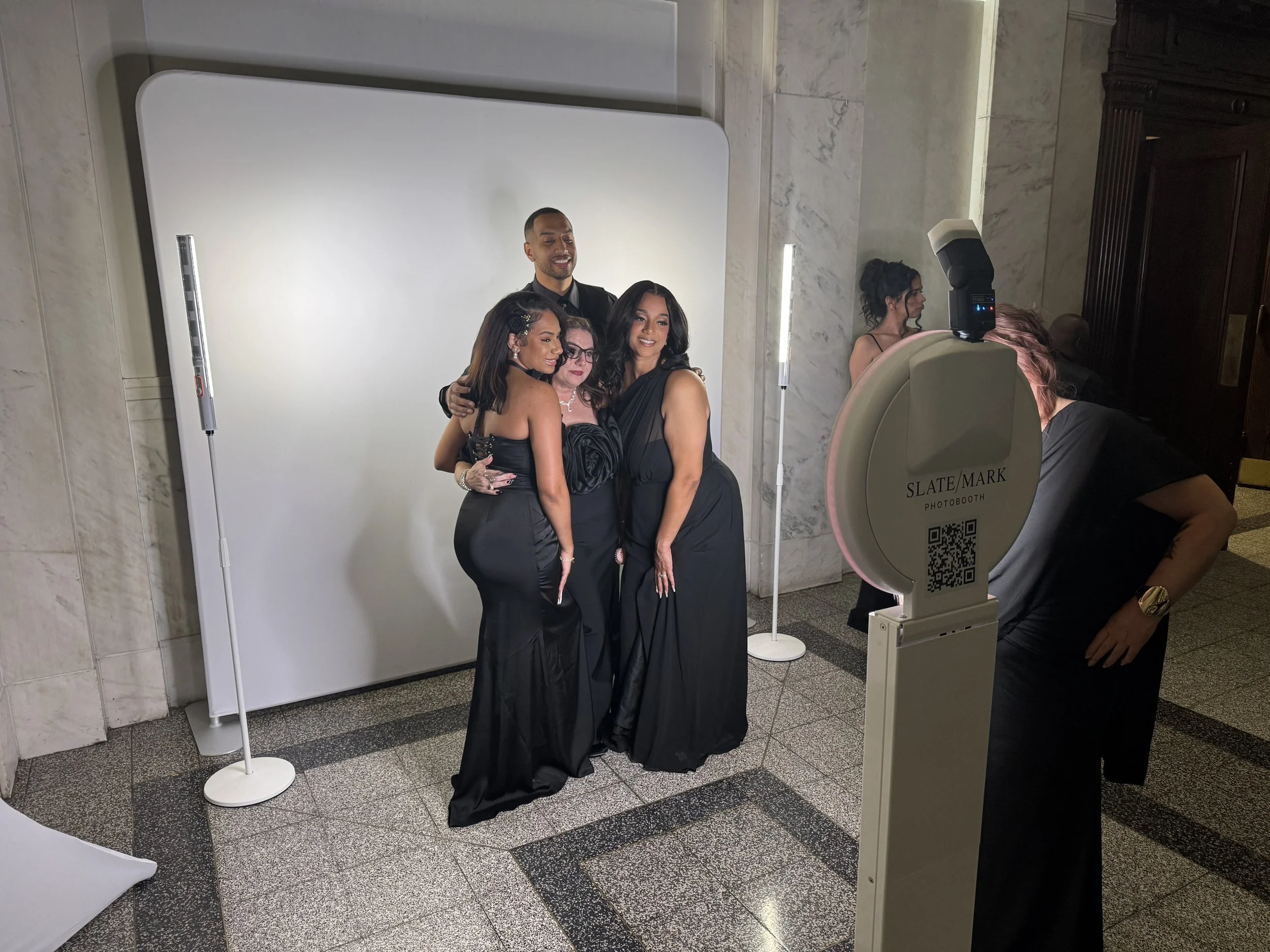 Guests using slate/mark photo booth experience at a wedding in Decatur, GA