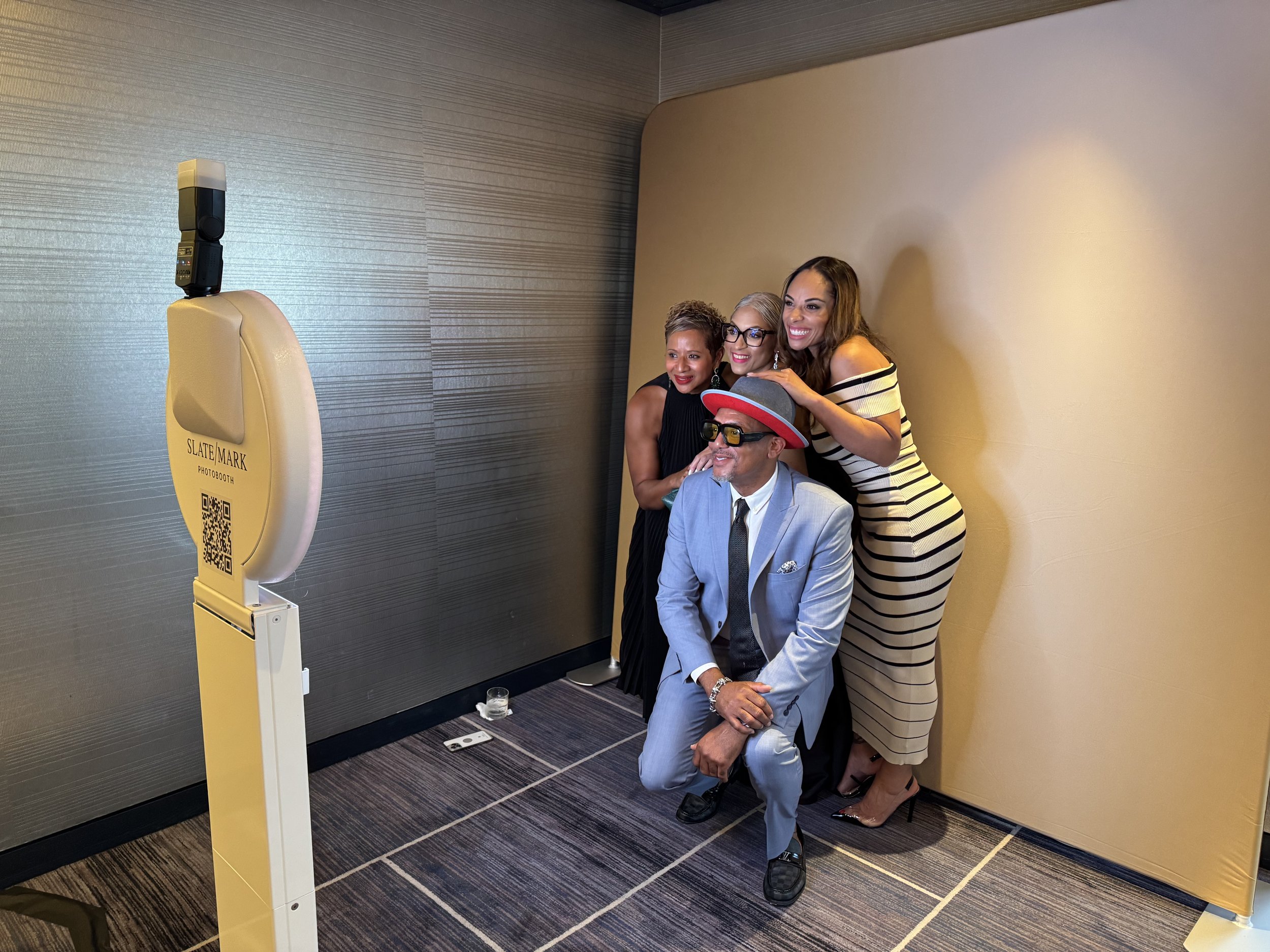 Corporate party guests posing in Slate/Mark Photo Booth in Atlanta, GA