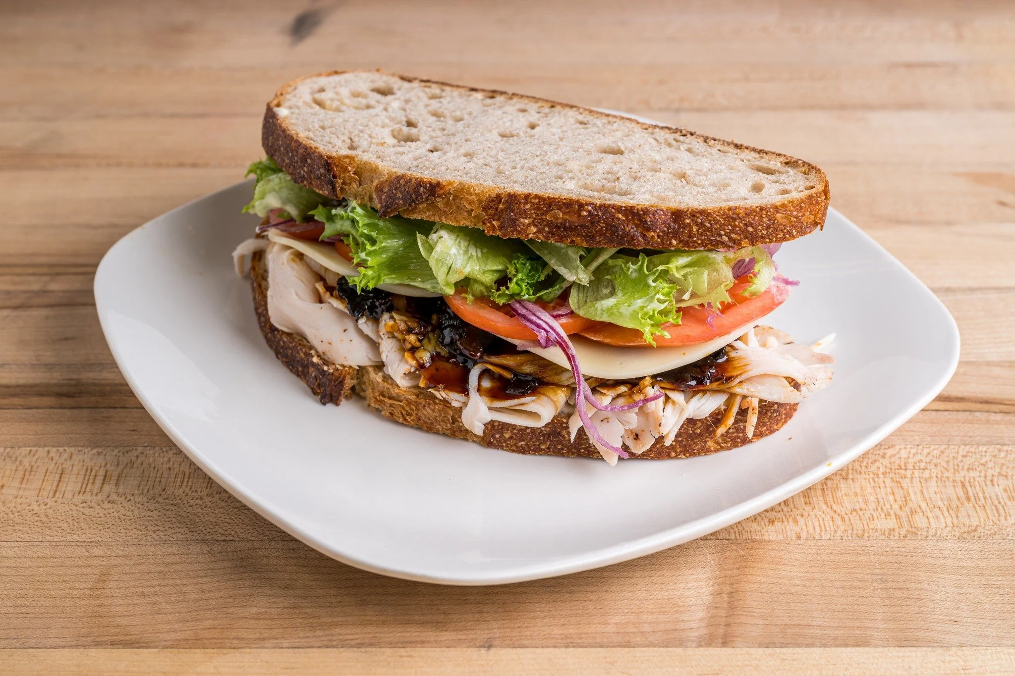 The Turkey Bacon-Jam 🥪

This one&rsquo;s a regular for a reason. House-roasted Misty Knoll turkey piled high, with provolone, all the usual fixings&hellip; and then the good stuff.

Our bacon jam is sweet, savory, a little sticky&mdash;in the best w